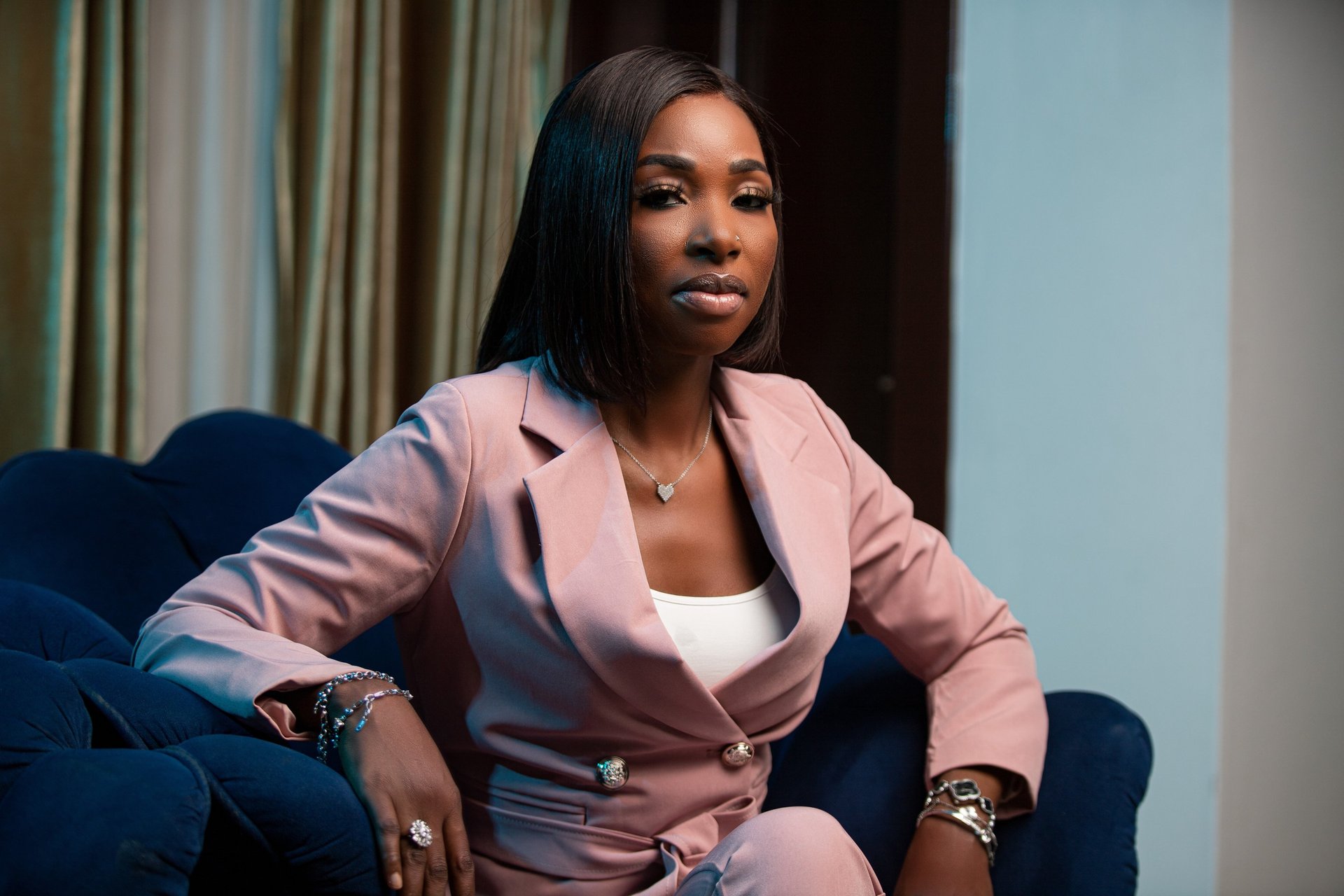 an abstract photo of a curved building with a blue sky in the background