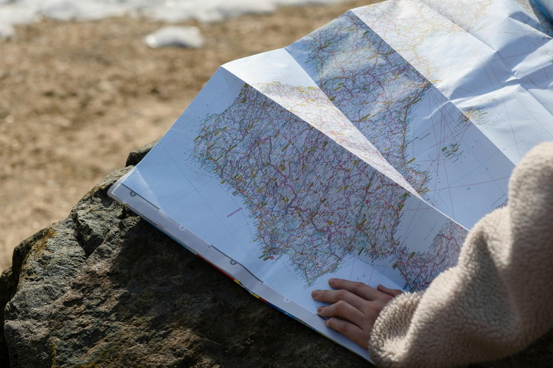 mountains near ocean under white clouds during daytime