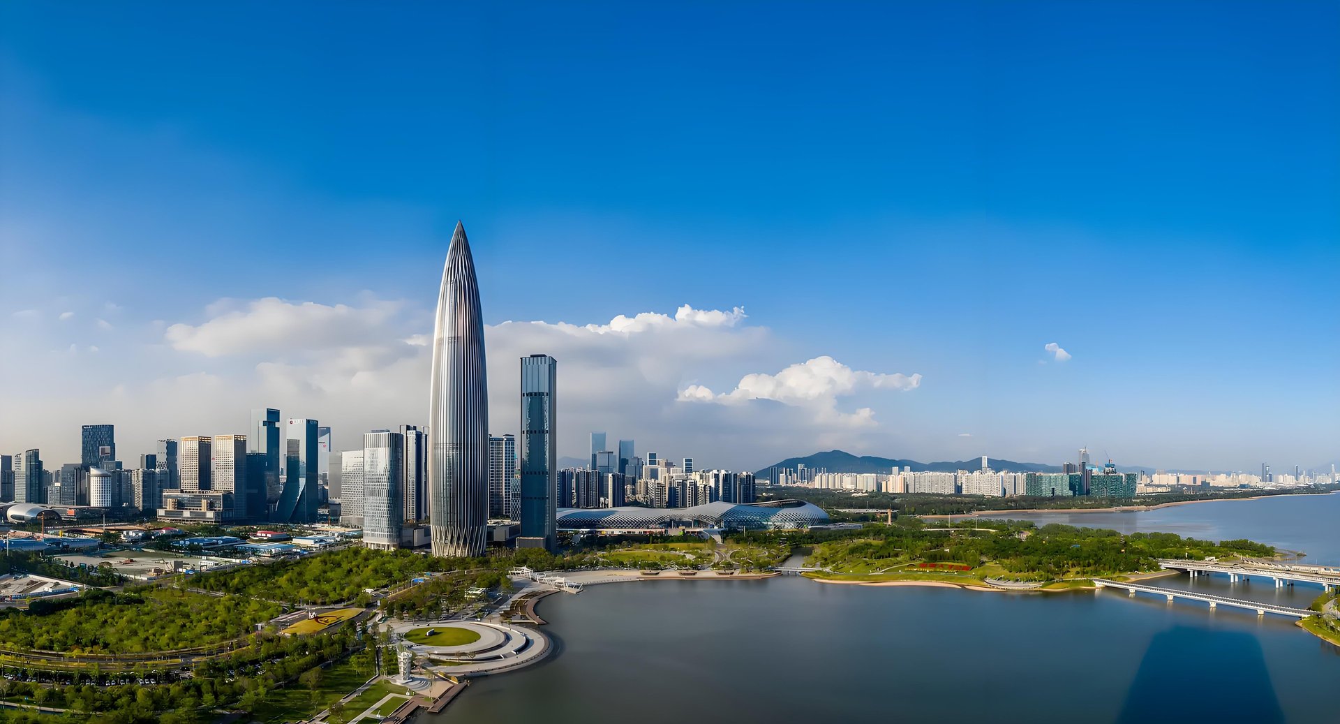 a large body of water with a city in the background