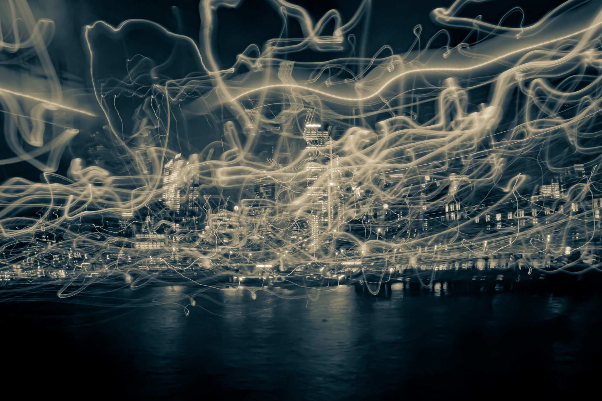 an abstract photo of a curved building with a blue sky in the background