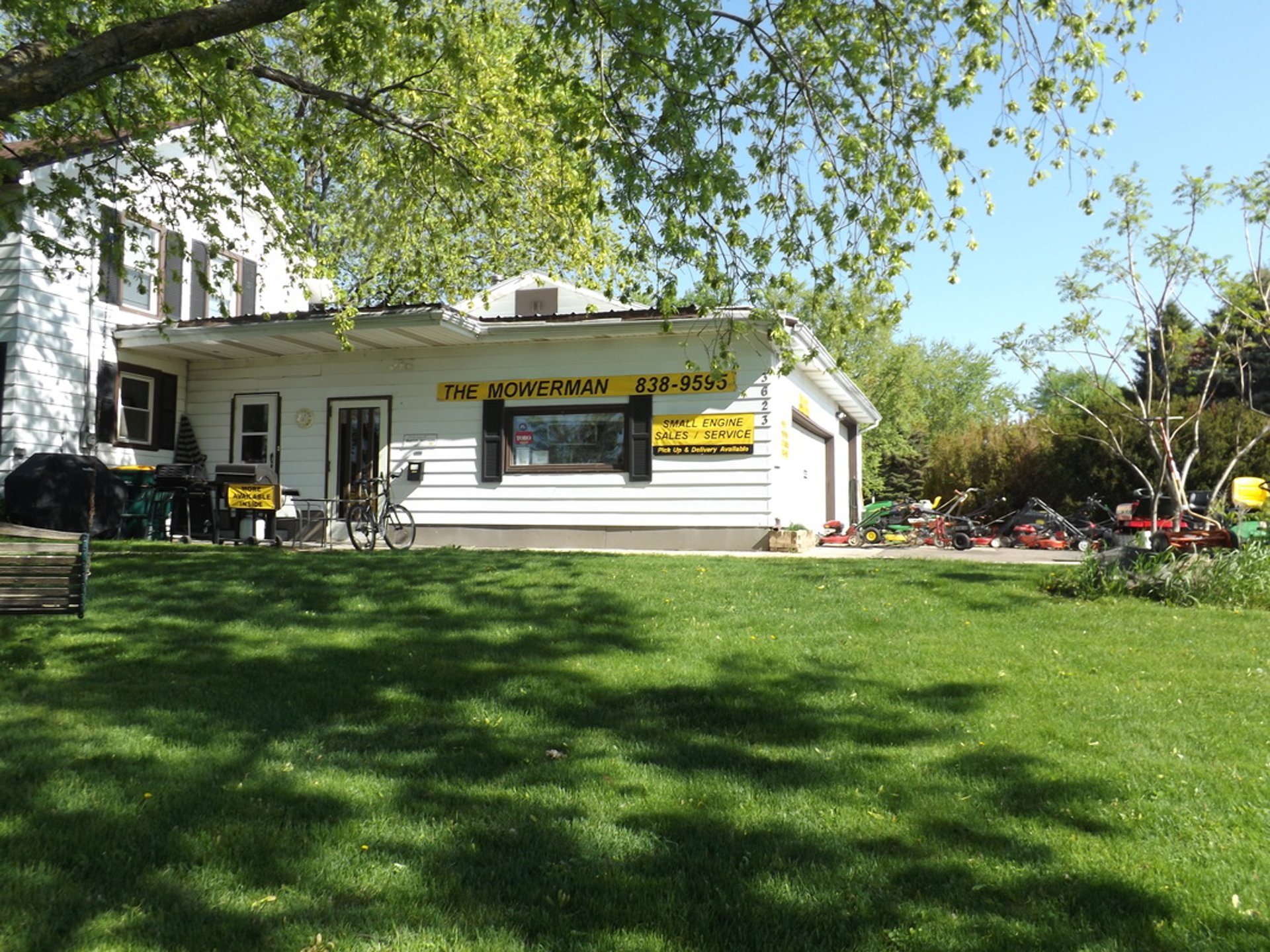 an abstract photo of a curved building with a blue sky in the background