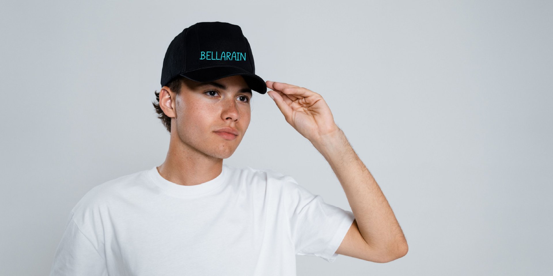 Bellarain handwritten type on a baseball cap.