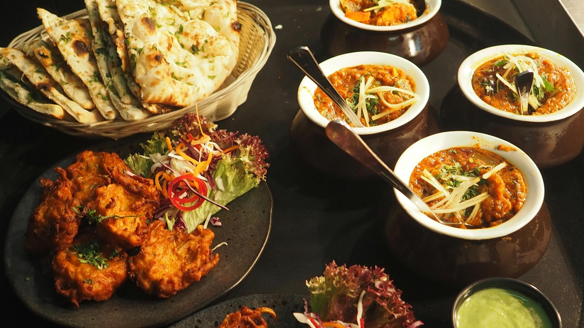 an abstract photo of a curved building with a blue sky in the background
