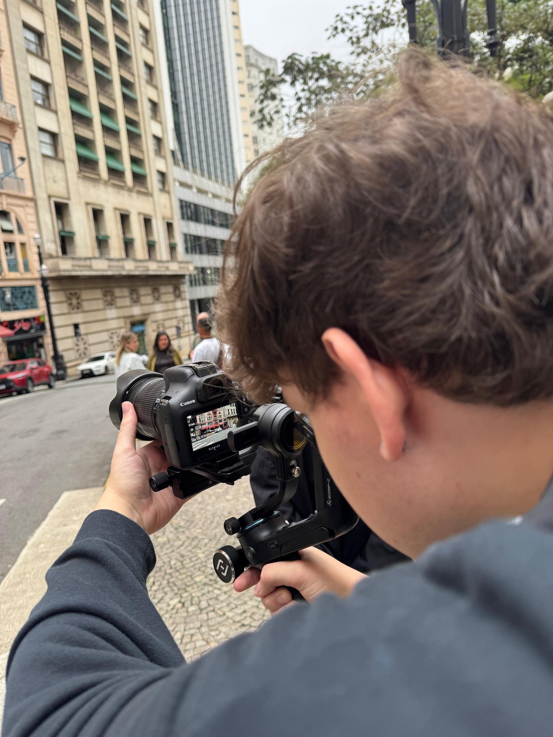 woman wearing yellow long-sleeved dress under white clouds and blue sky during daytime