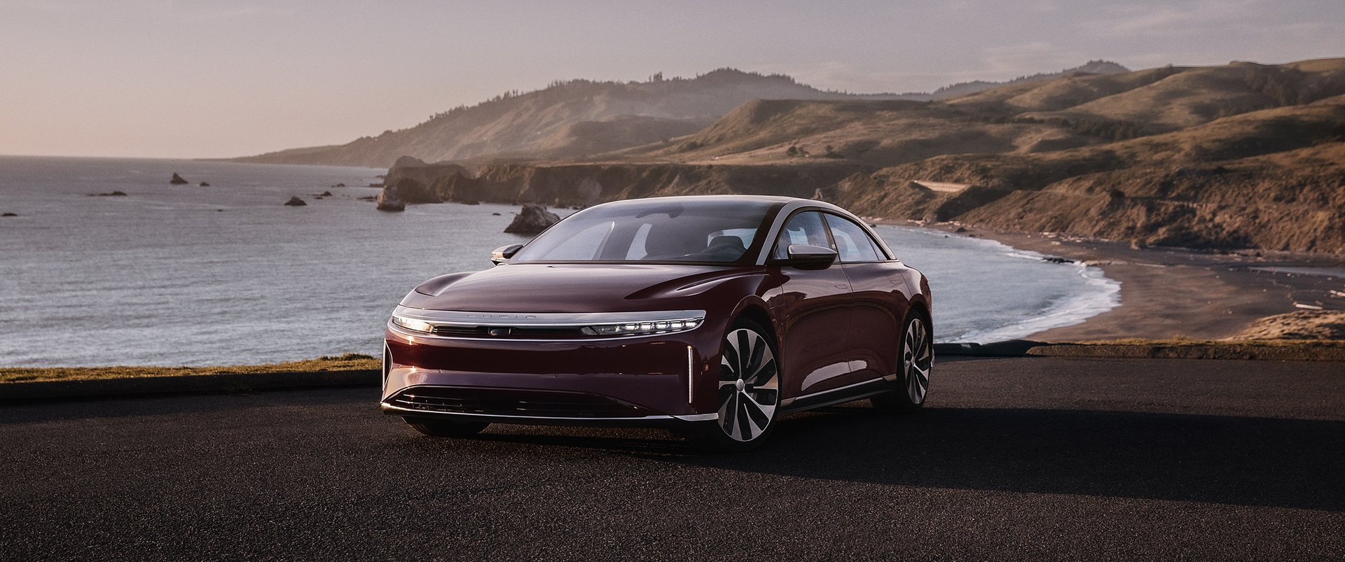 an abstract photo of a curved building with a blue sky in the background