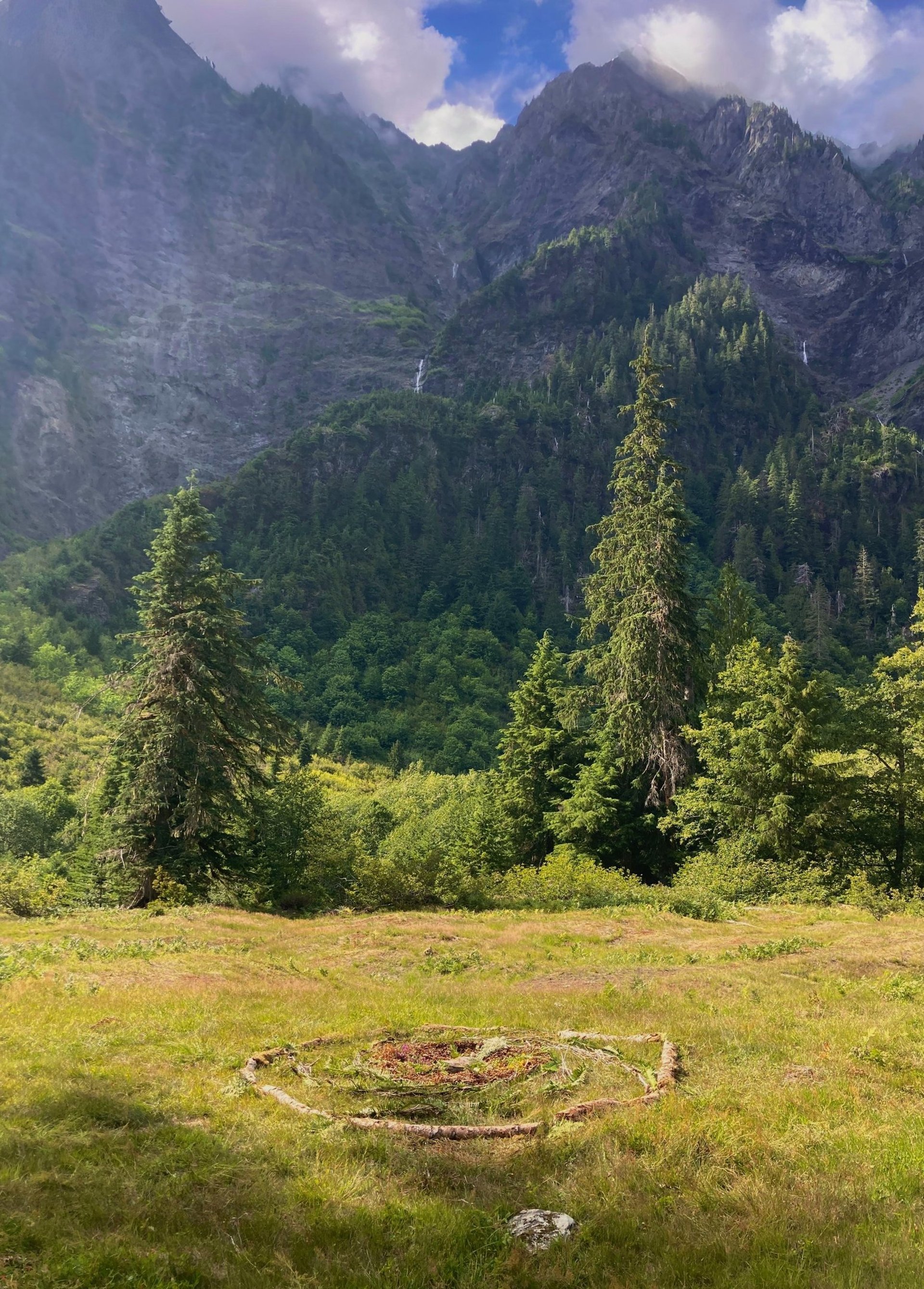 man on top brown hill