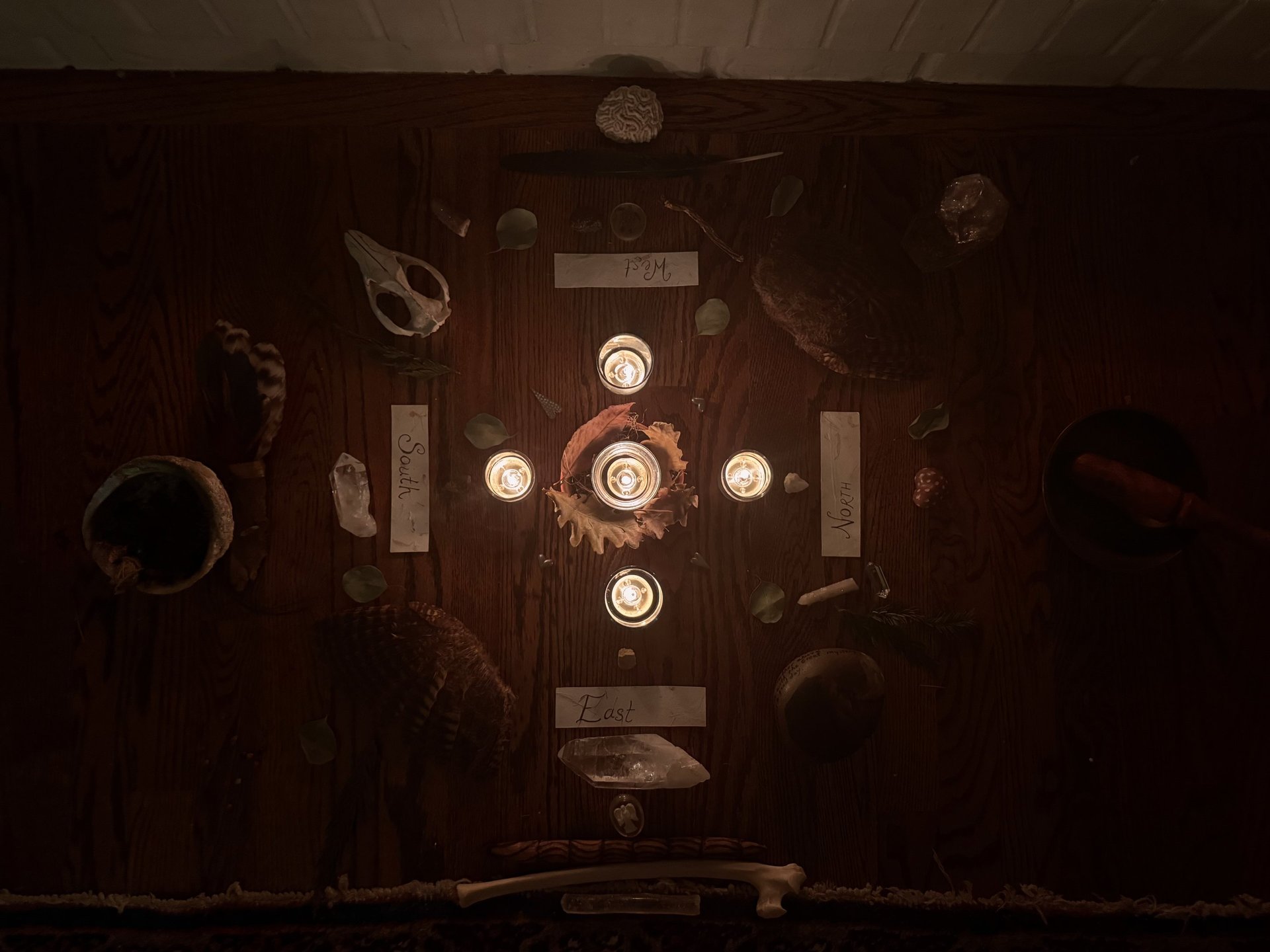 three lit candles sitting on top of a table