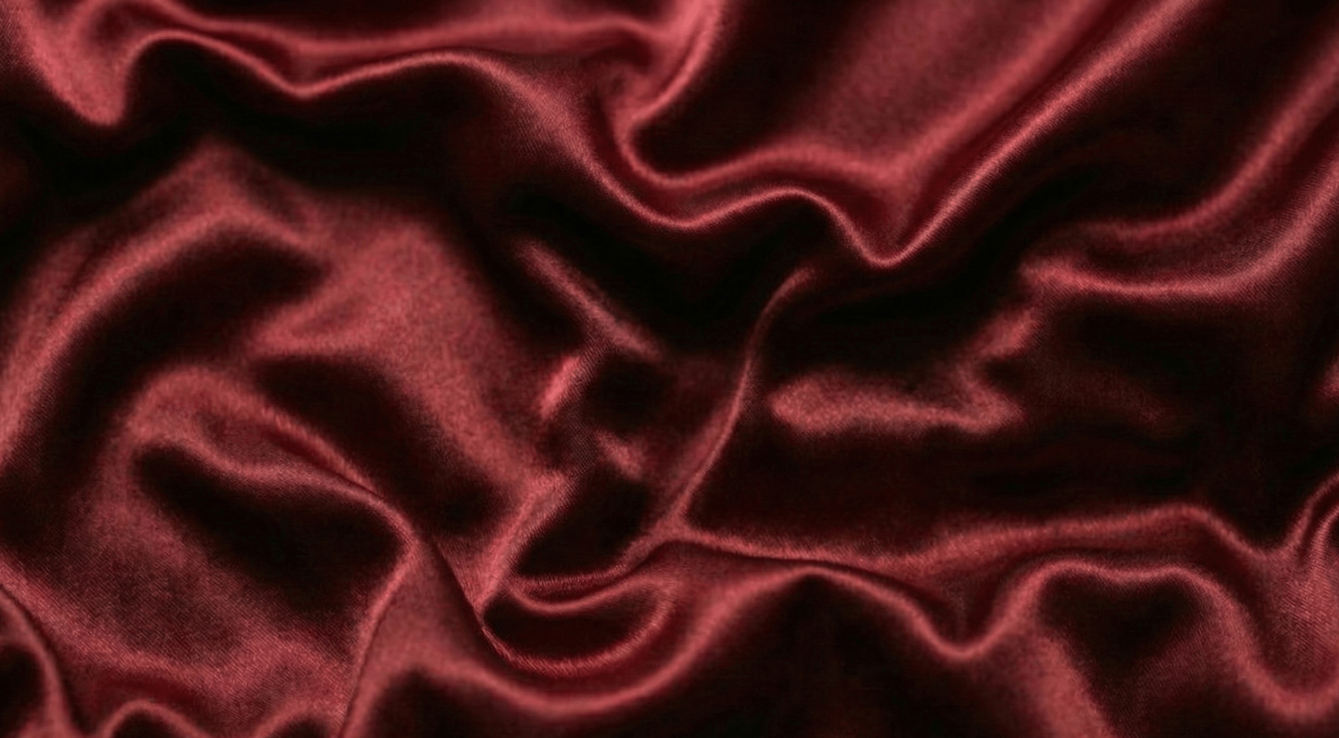 a close up of a black and brown abstract painting