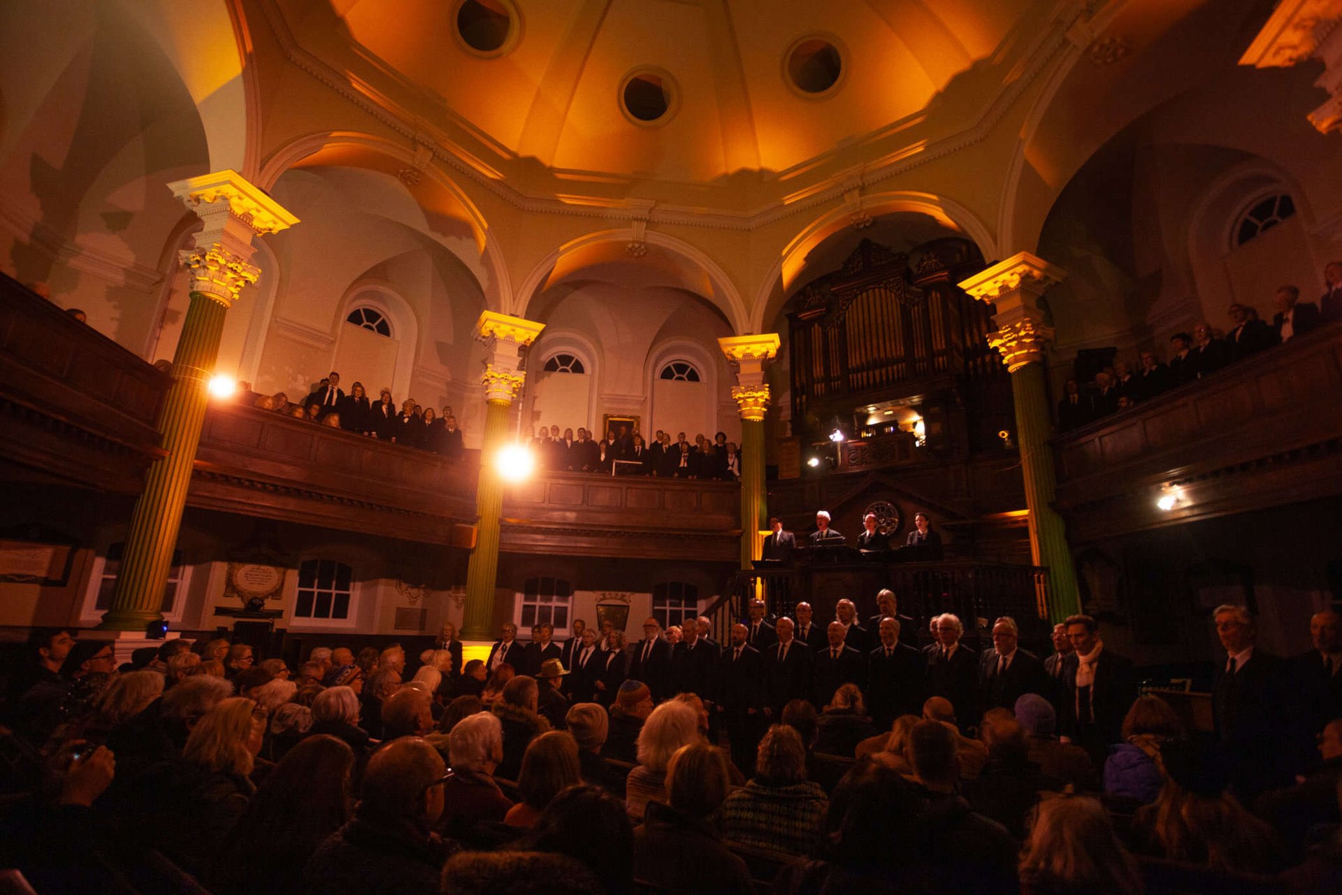an abstract photo of a curved building with a blue sky in the background