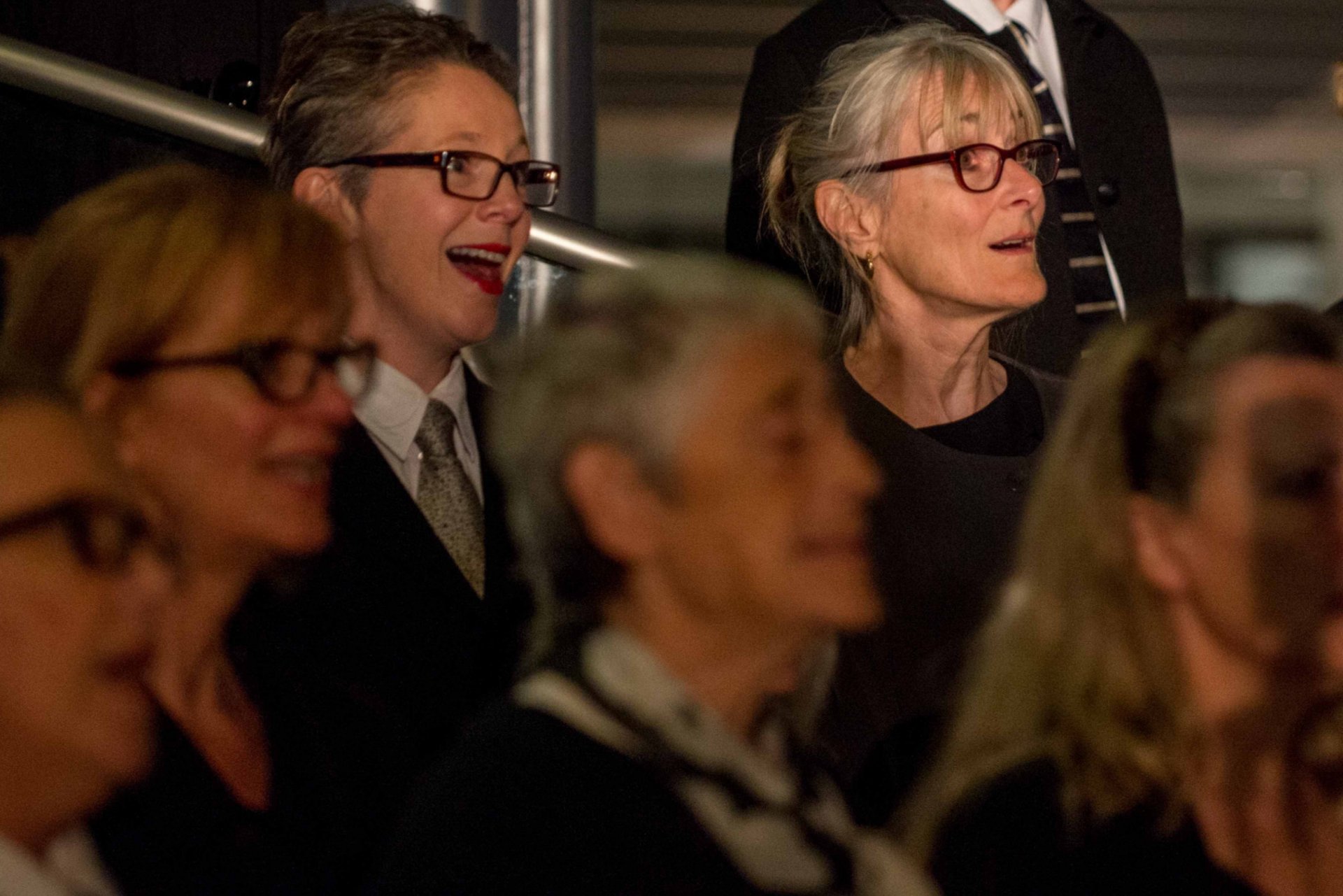 an abstract photo of a curved building with a blue sky in the background