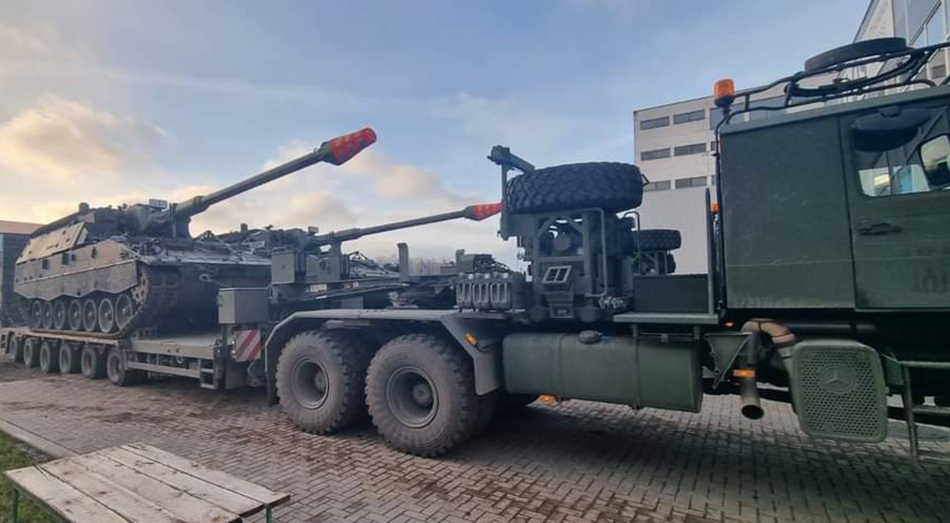 an abstract photo of a curved building with a blue sky in the background