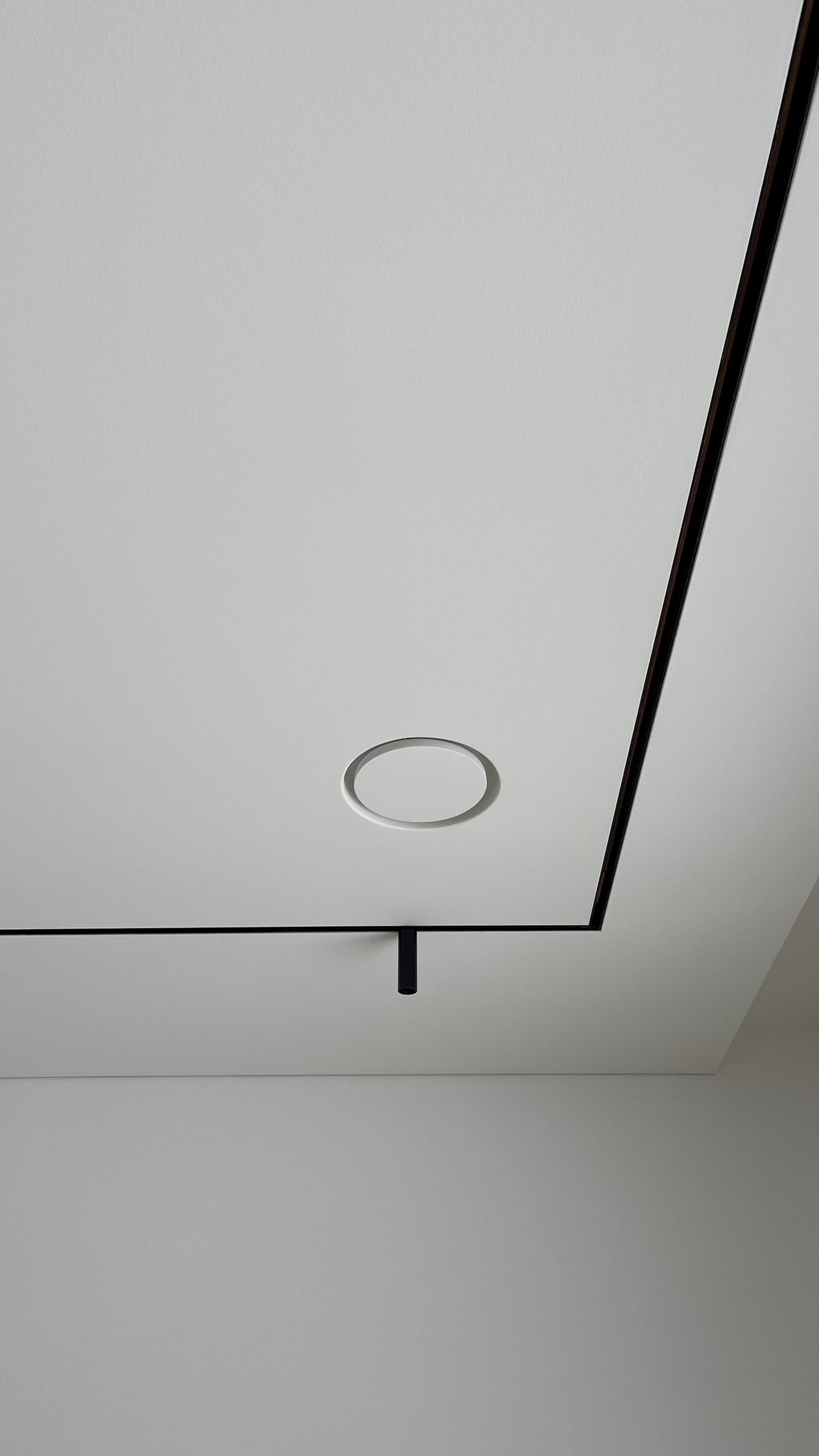 ERGOVENT RONDO round frameless diffuser flush-mounted in white gypsum ceiling, invisible after installation