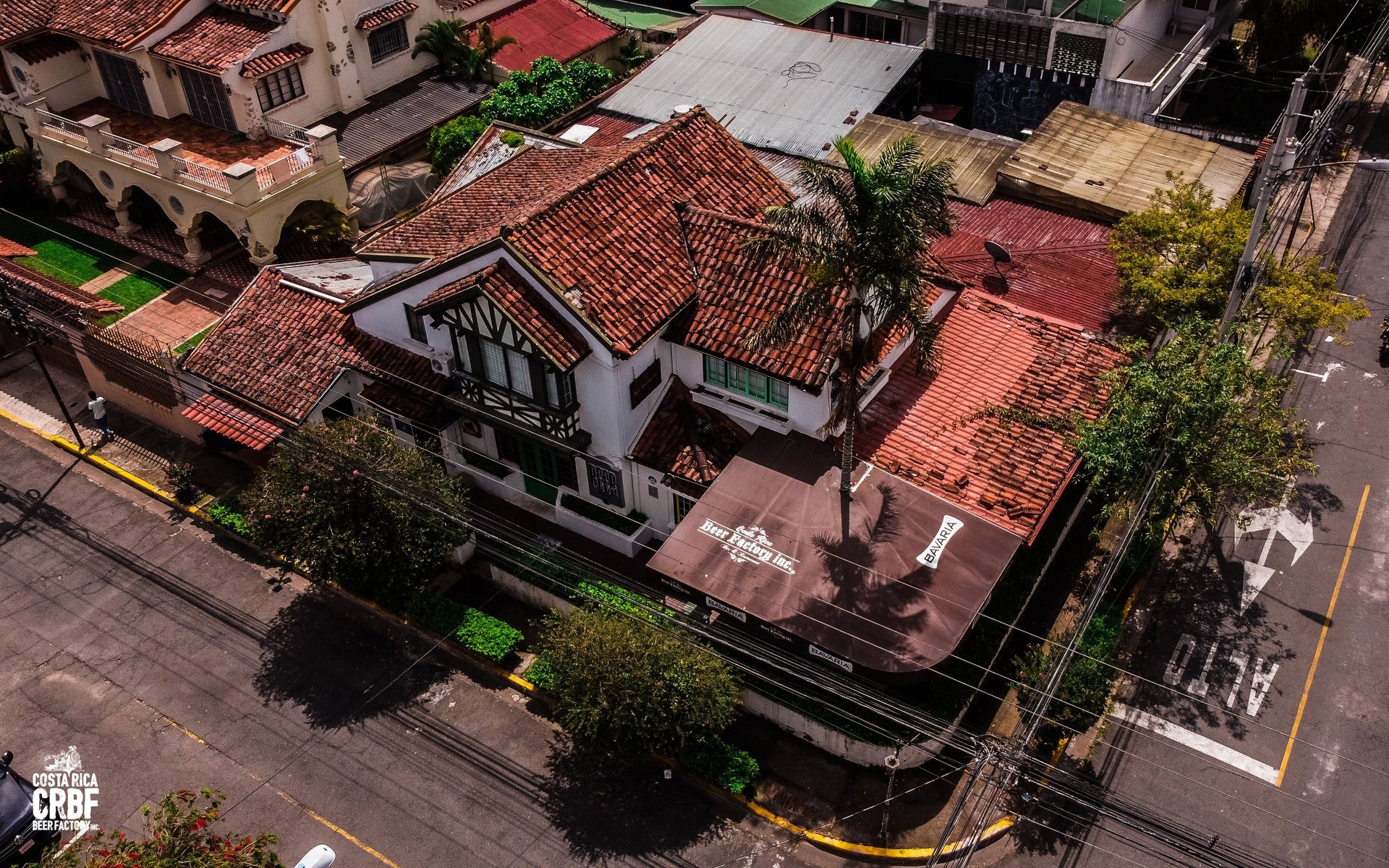 an abstract photo of a curved building with a blue sky in the background