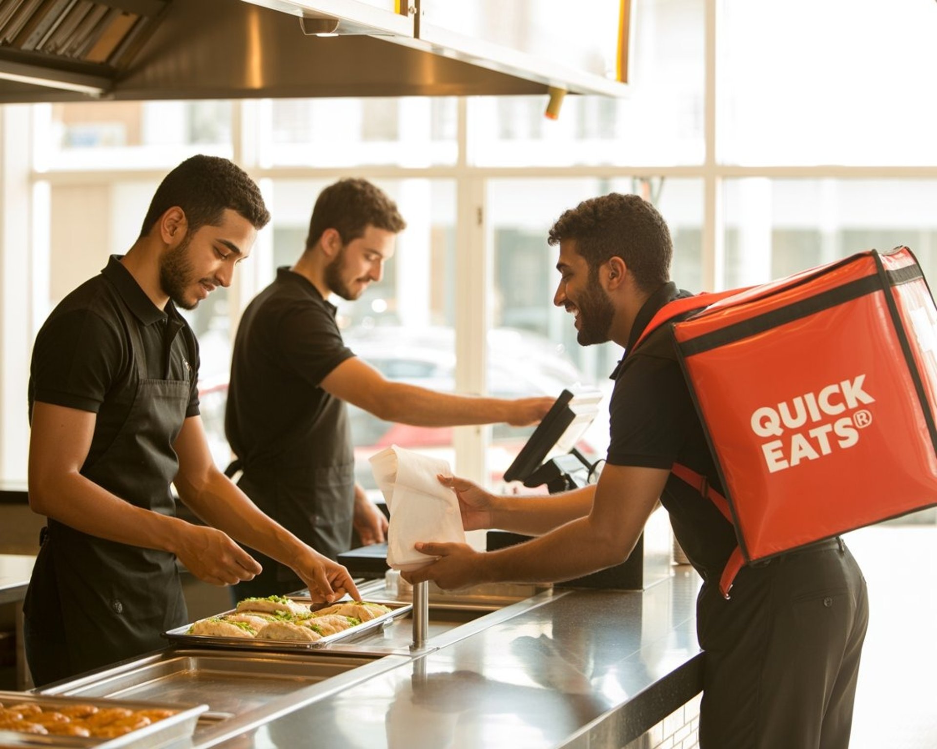 an abstract photo of a curved building with a blue sky in the background