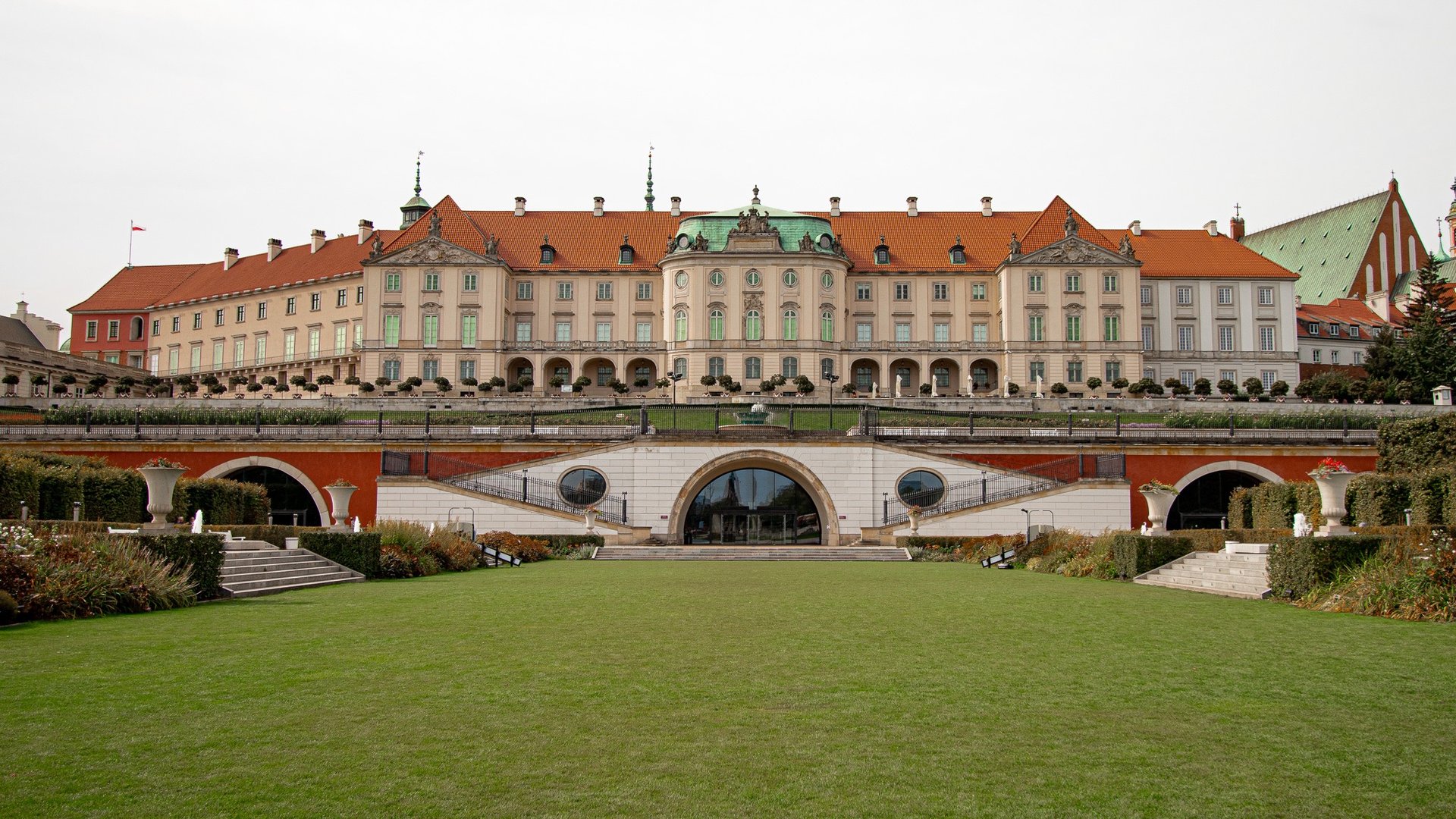 an abstract photo of a curved building with a blue sky in the background