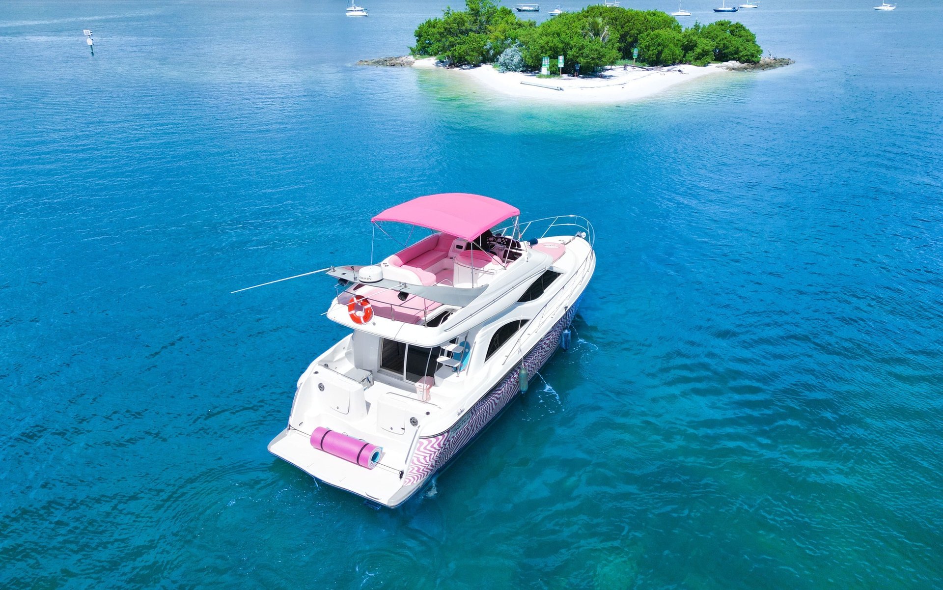 Miami yacht rental Pink Yacht maxum flybridge boat for up to 13 guests