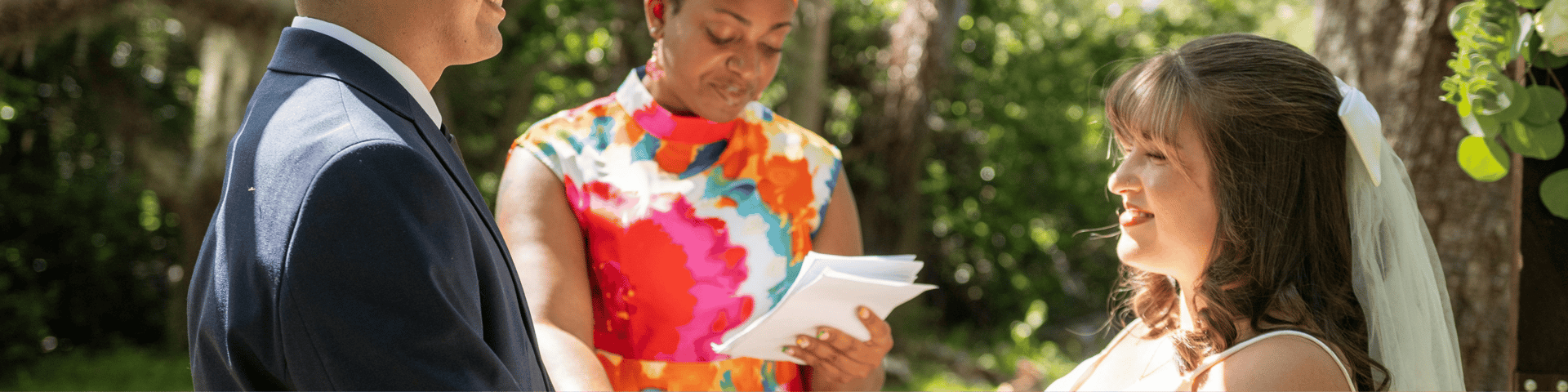 woman in white shirt holding pen writing on white paper