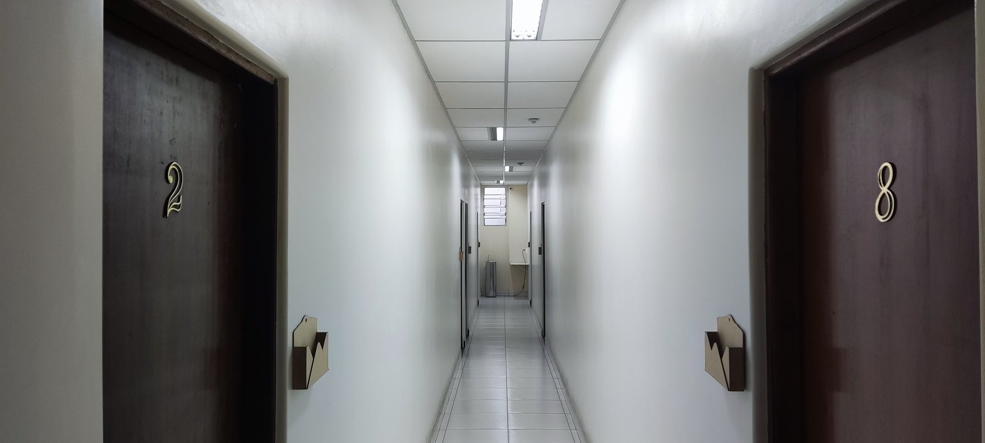 black and brown leather padded tub sofa