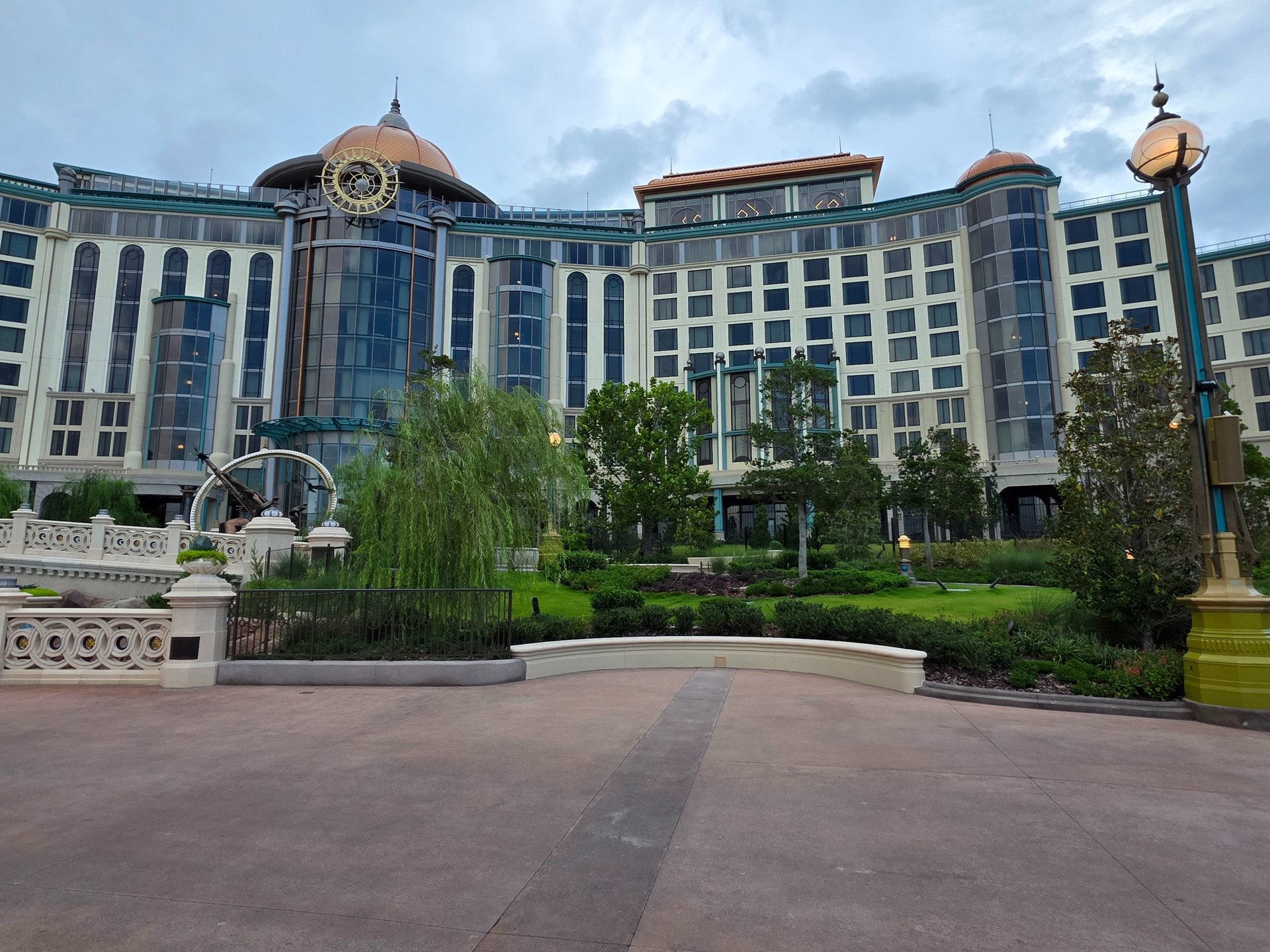 A rainbow waterfall is lit up at night