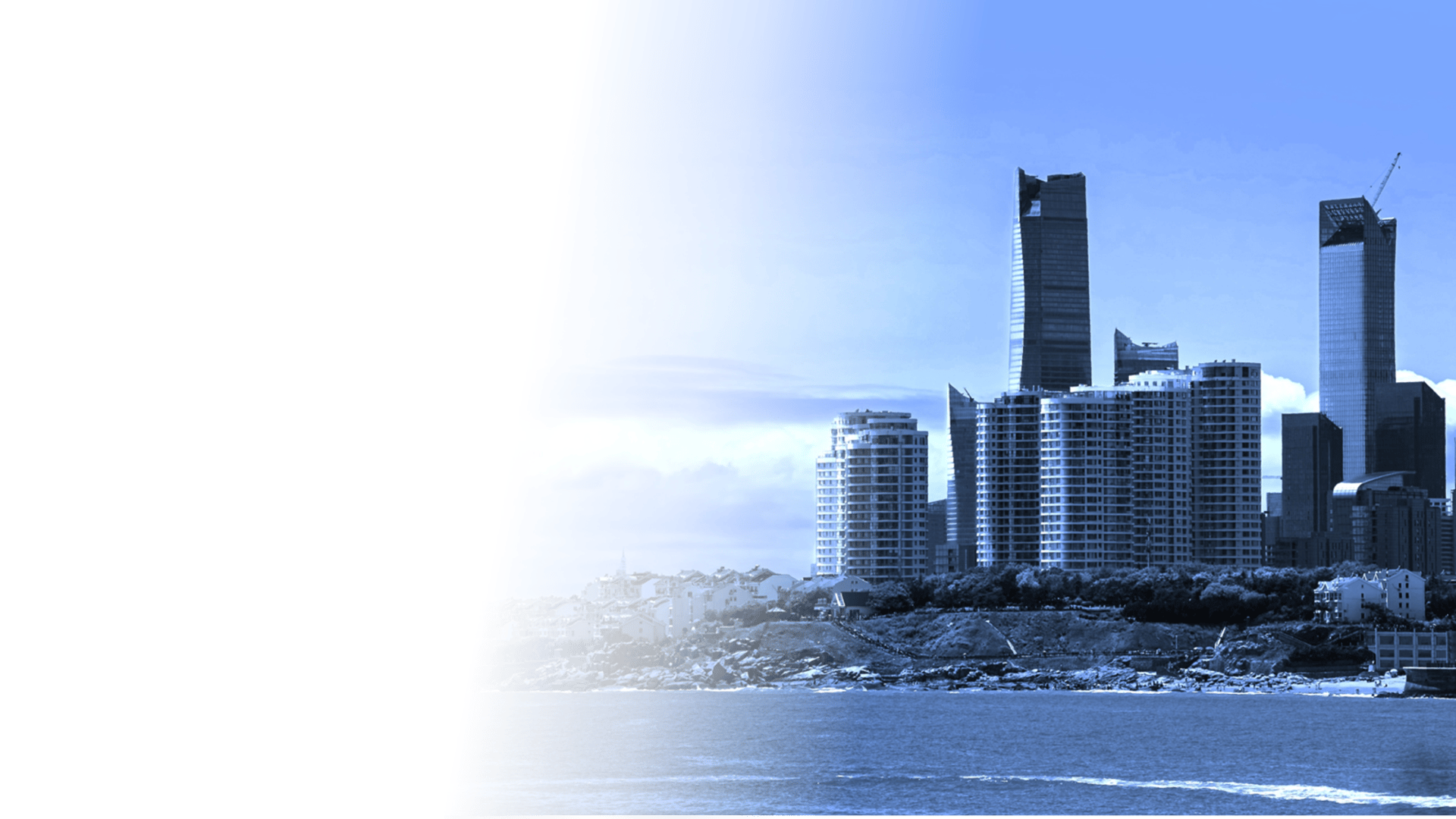 a body of water with a city in the background