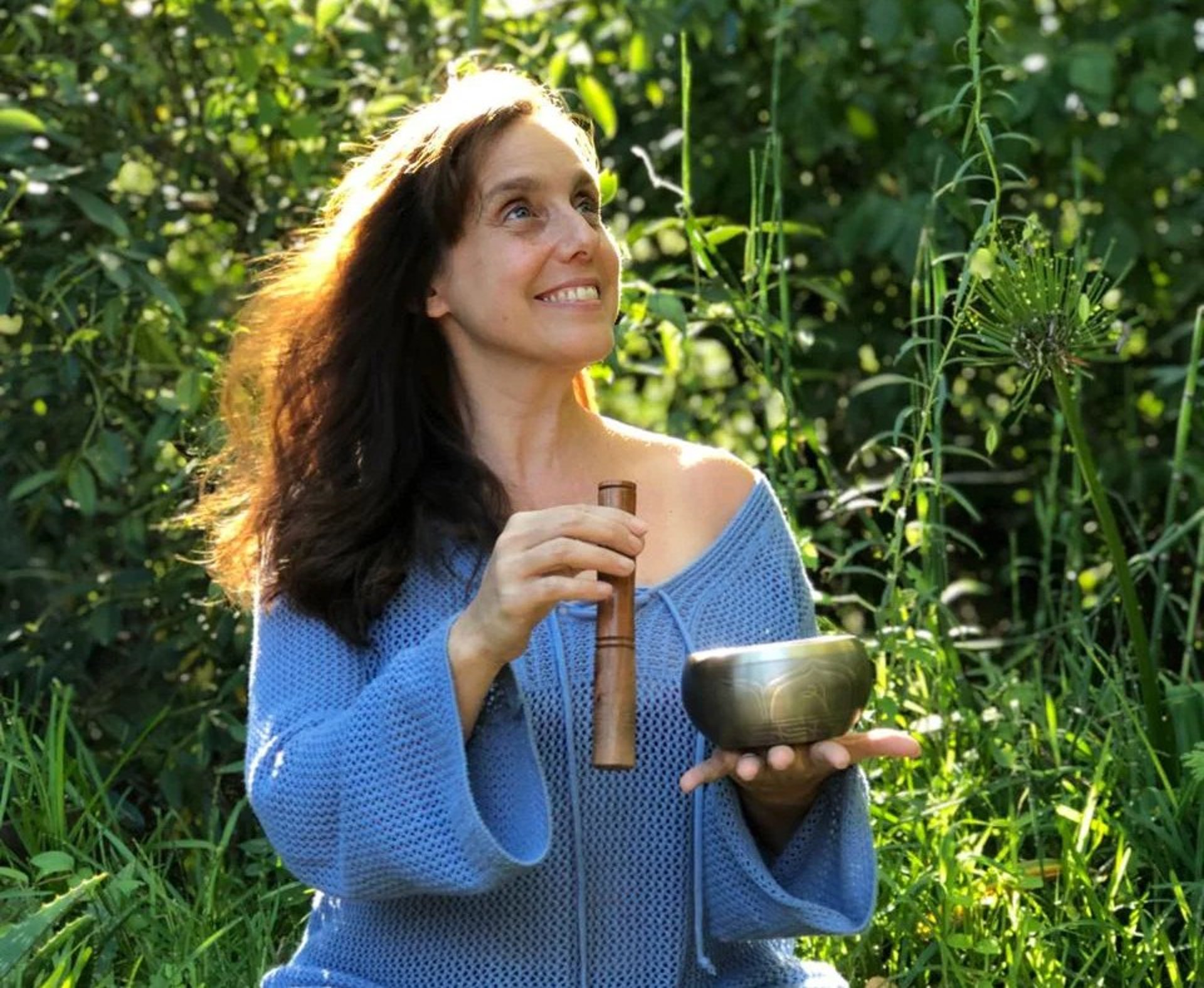 woman in black tank top and black leggings doing yoga