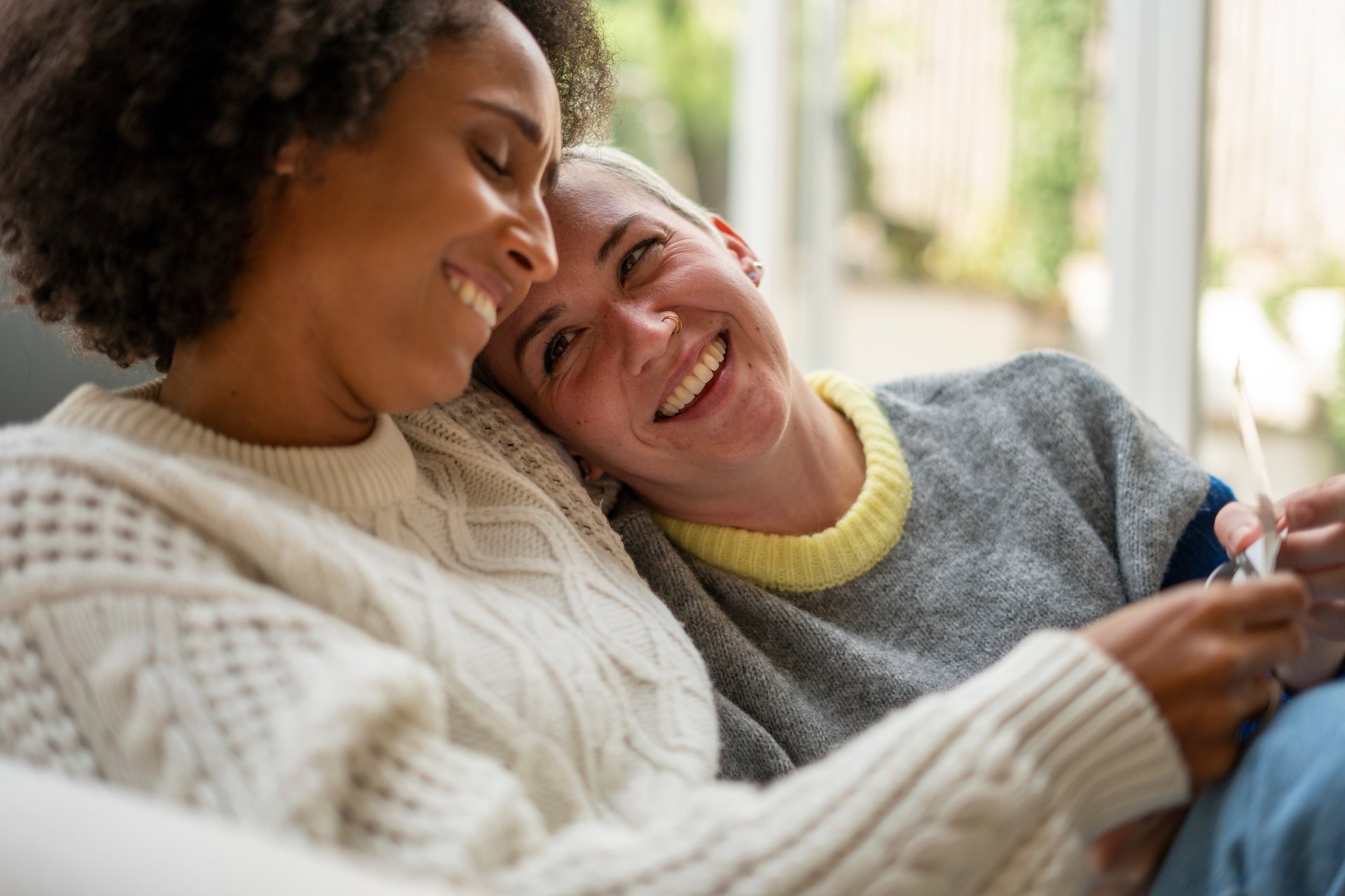 an abstract photo of a curved building with a blue sky in the background