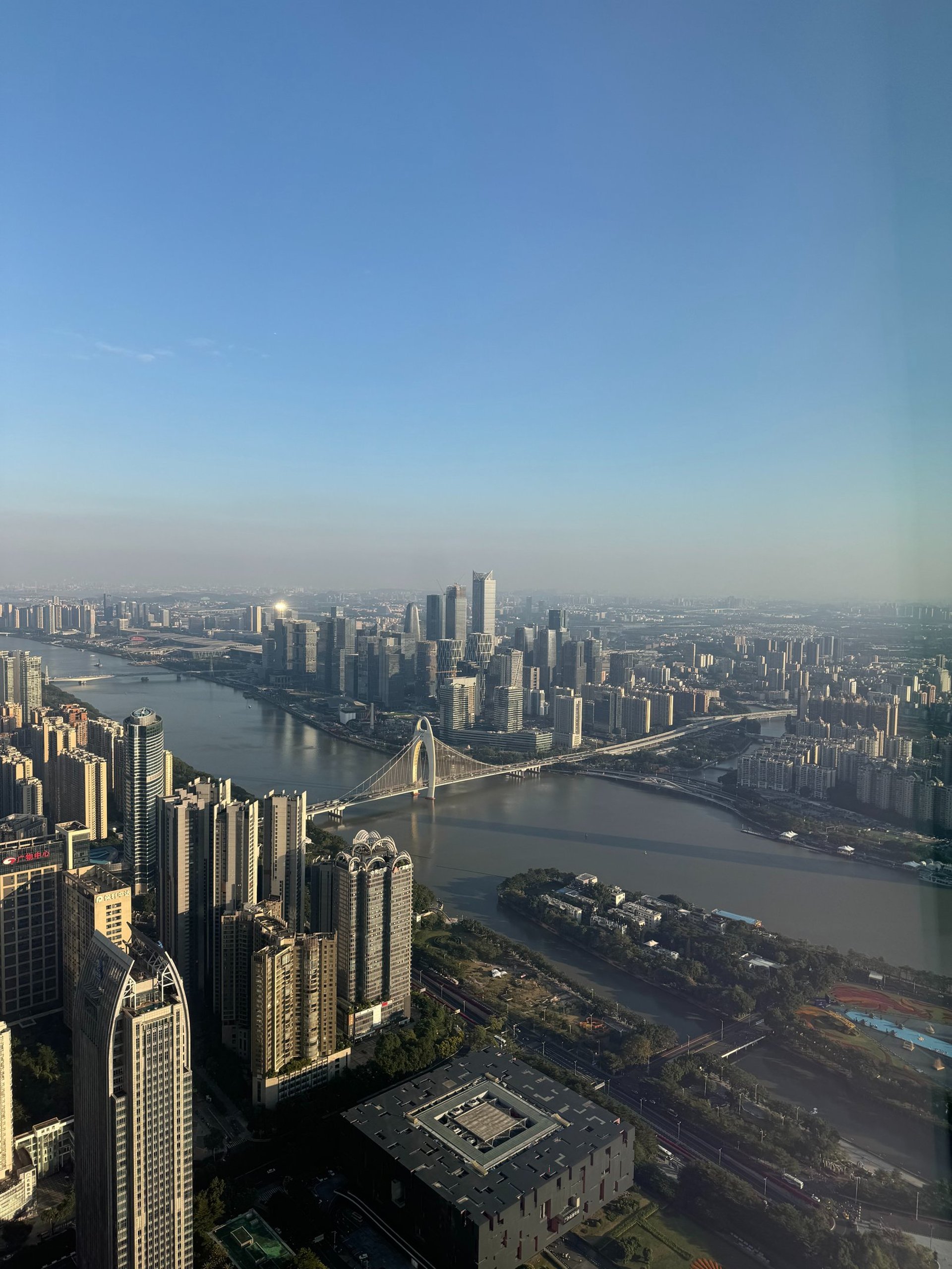 an abstract photo of a curved building with a blue sky in the background