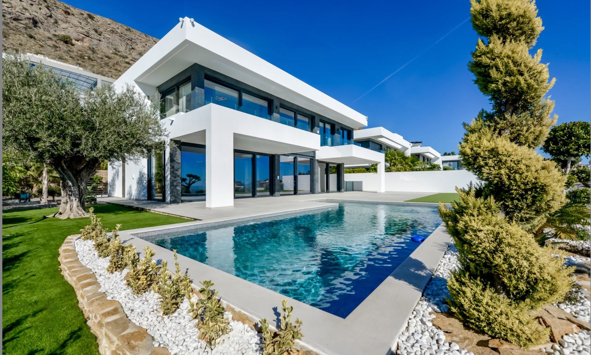 a white building with palm trees