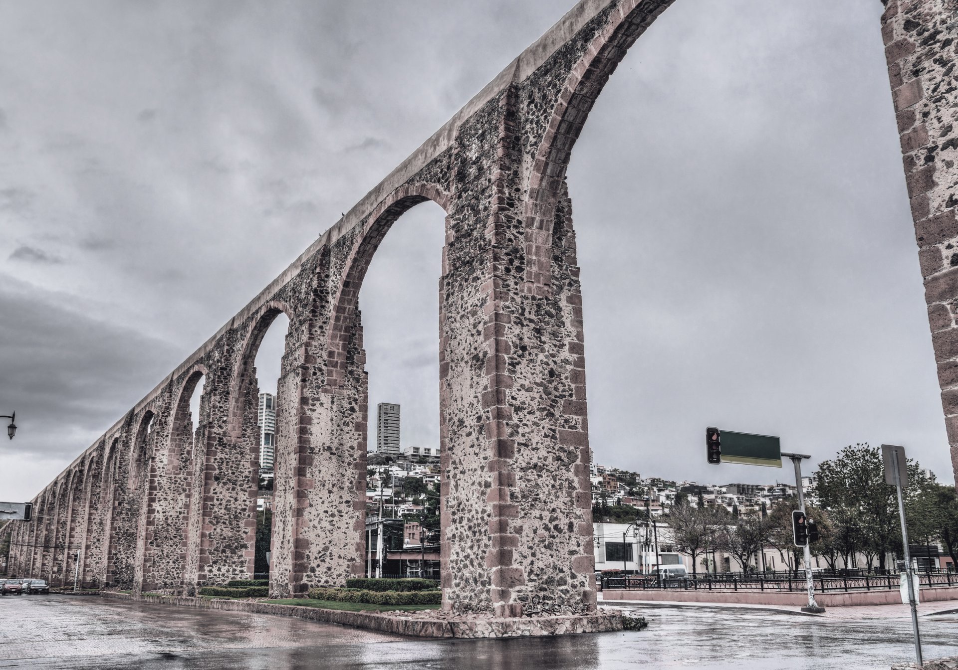 A black and white photo of a building at night