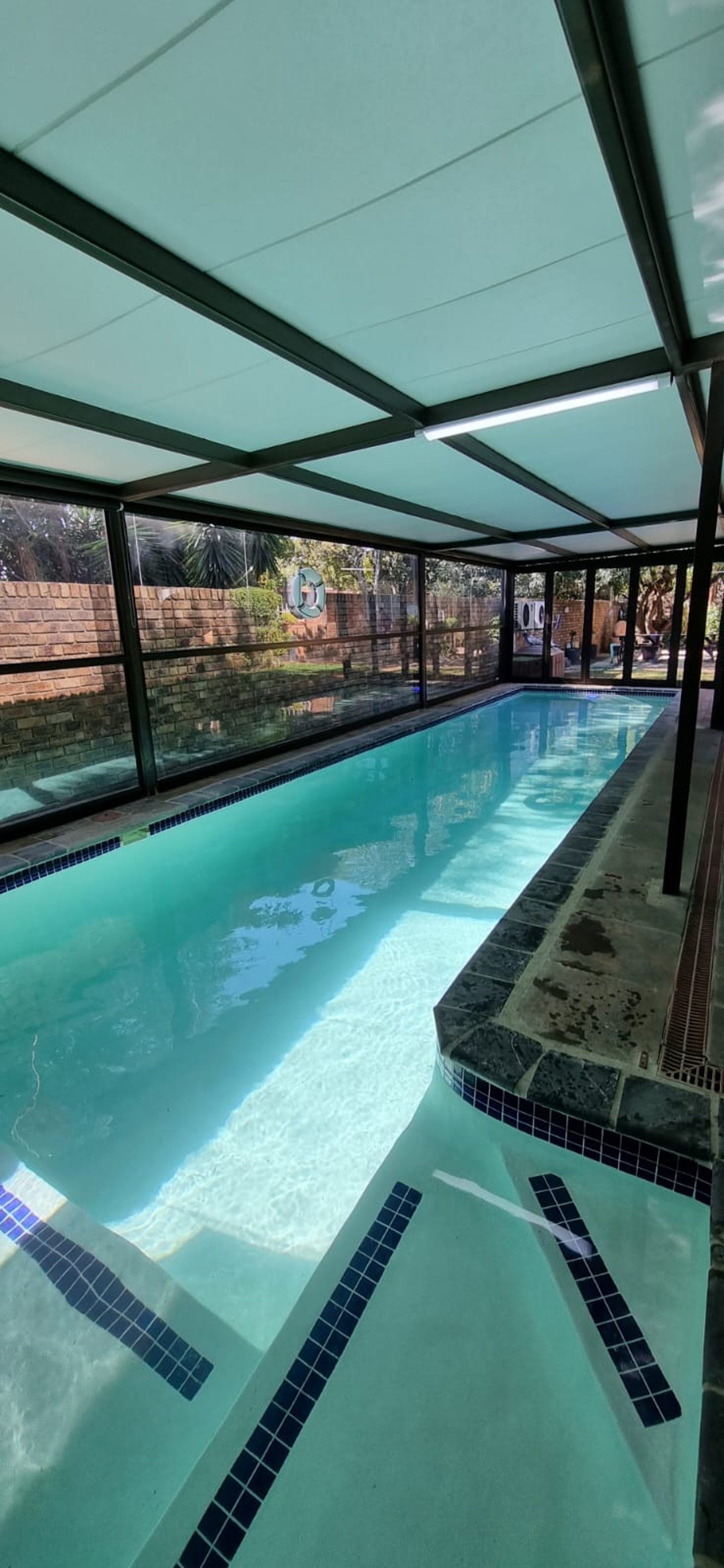black and brown leather padded tub sofa