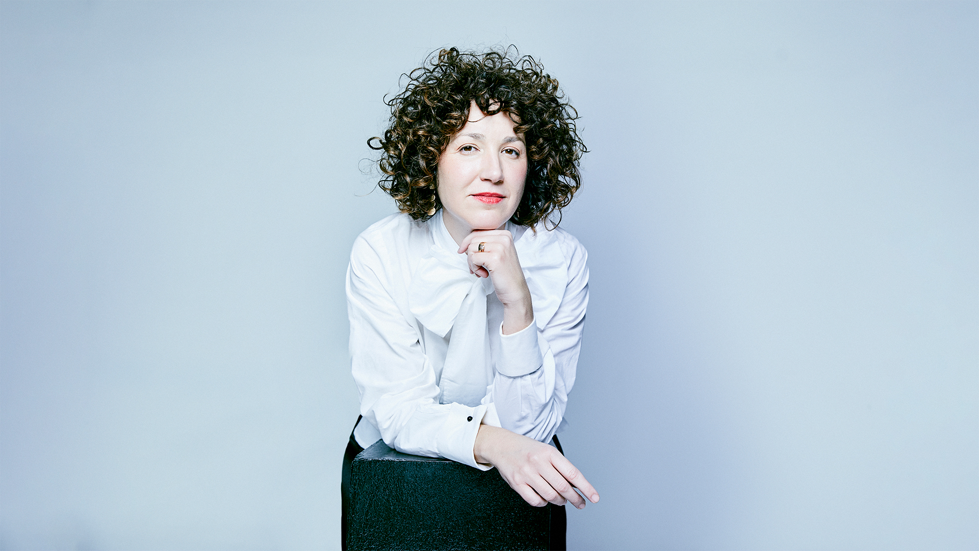 A white sculpture is shown against a white background