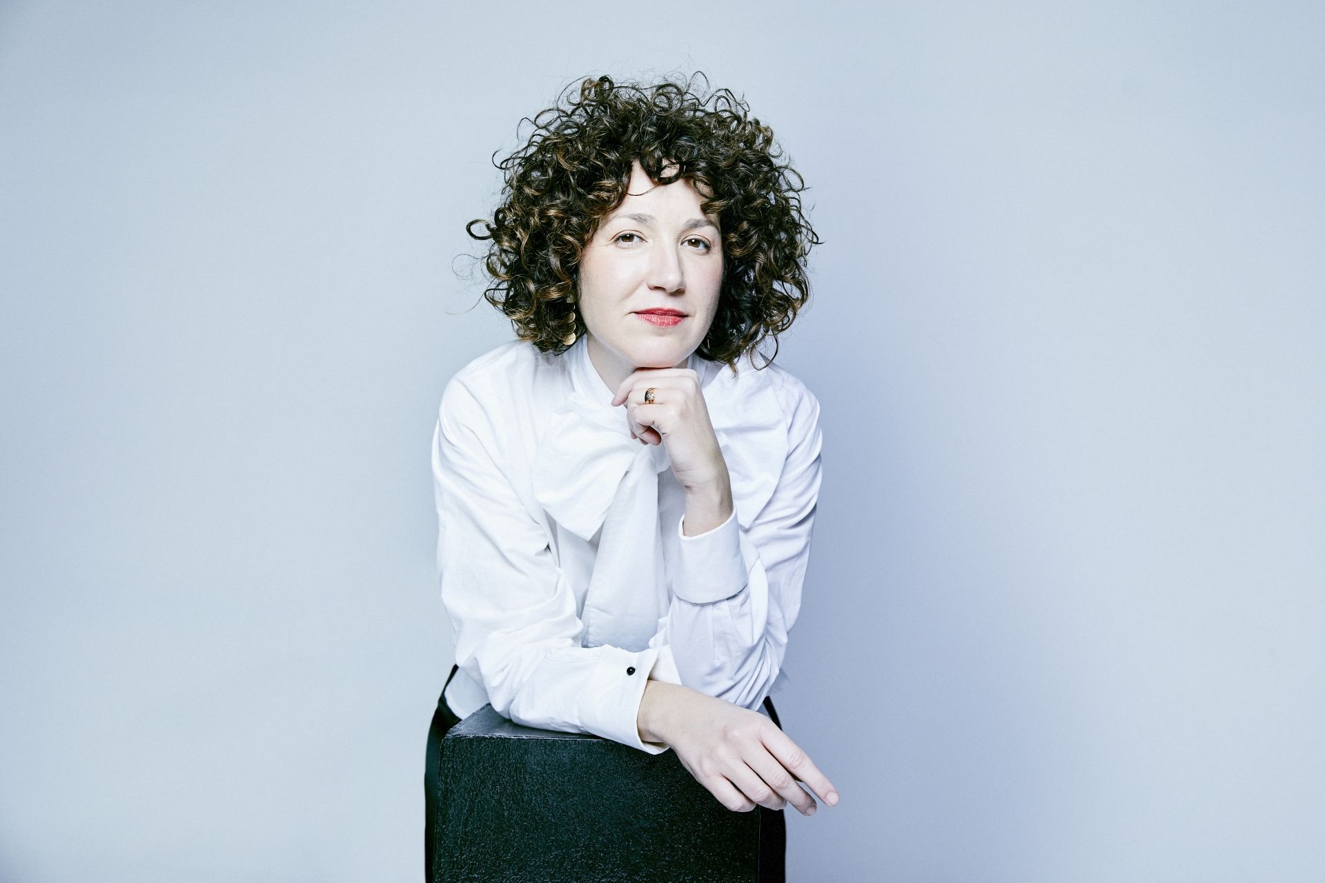 A white sculpture is shown against a white background