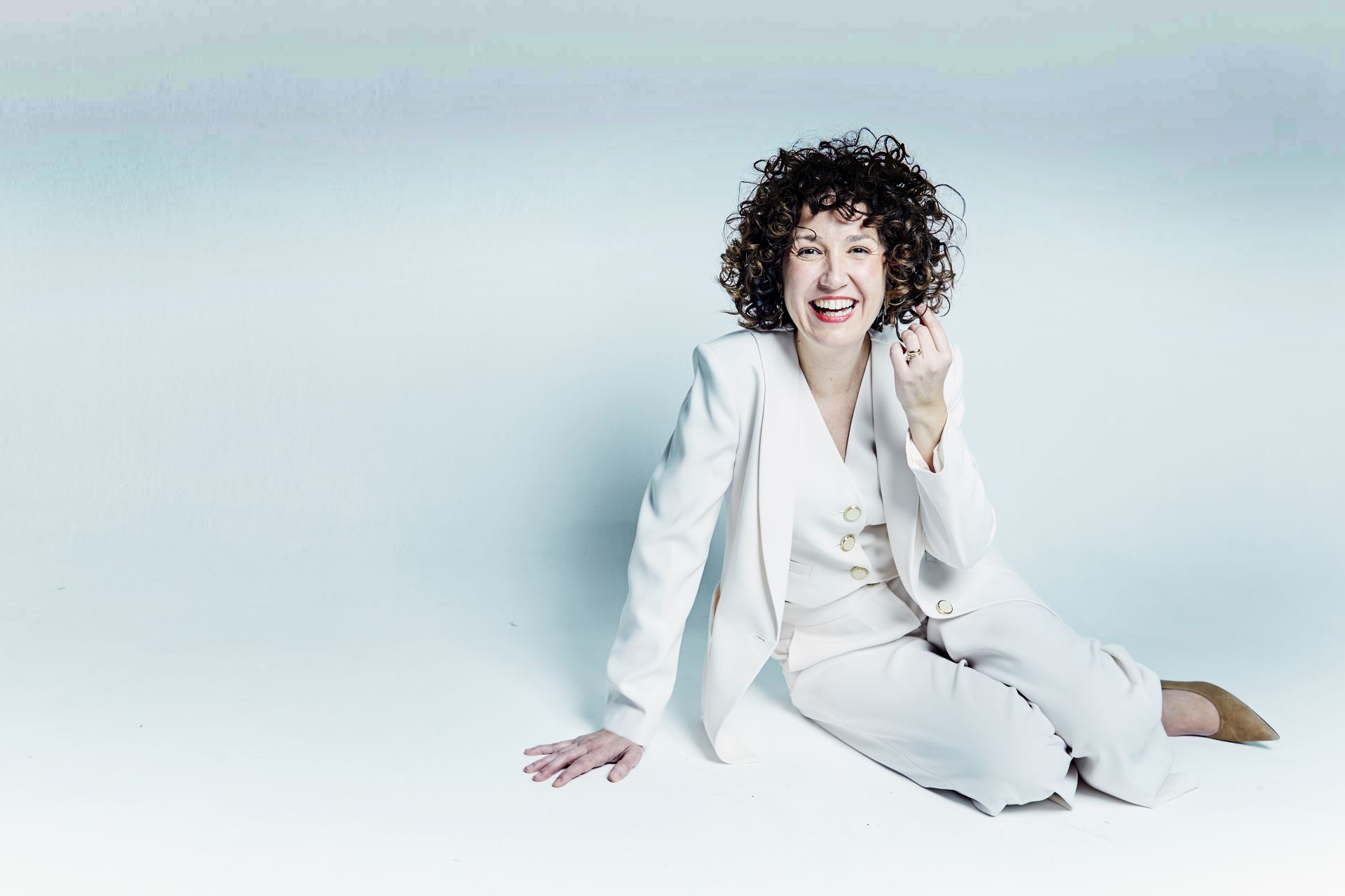 A white sculpture is shown against a white background