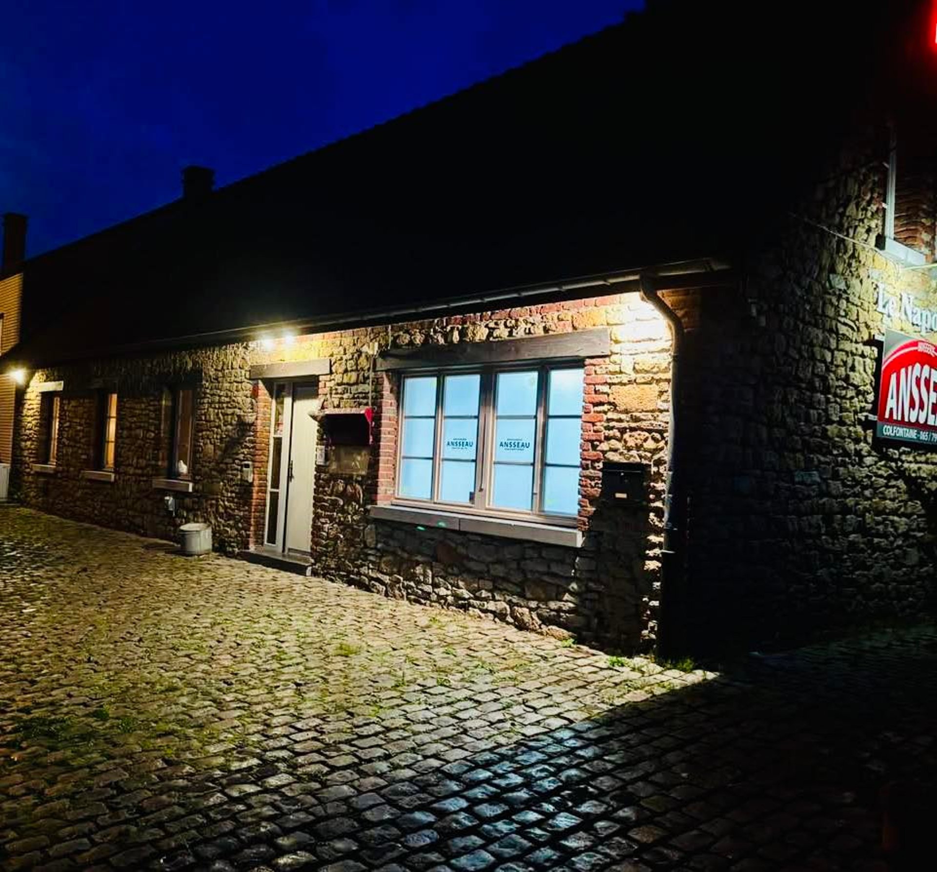 an abstract photo of a curved building with a blue sky in the background