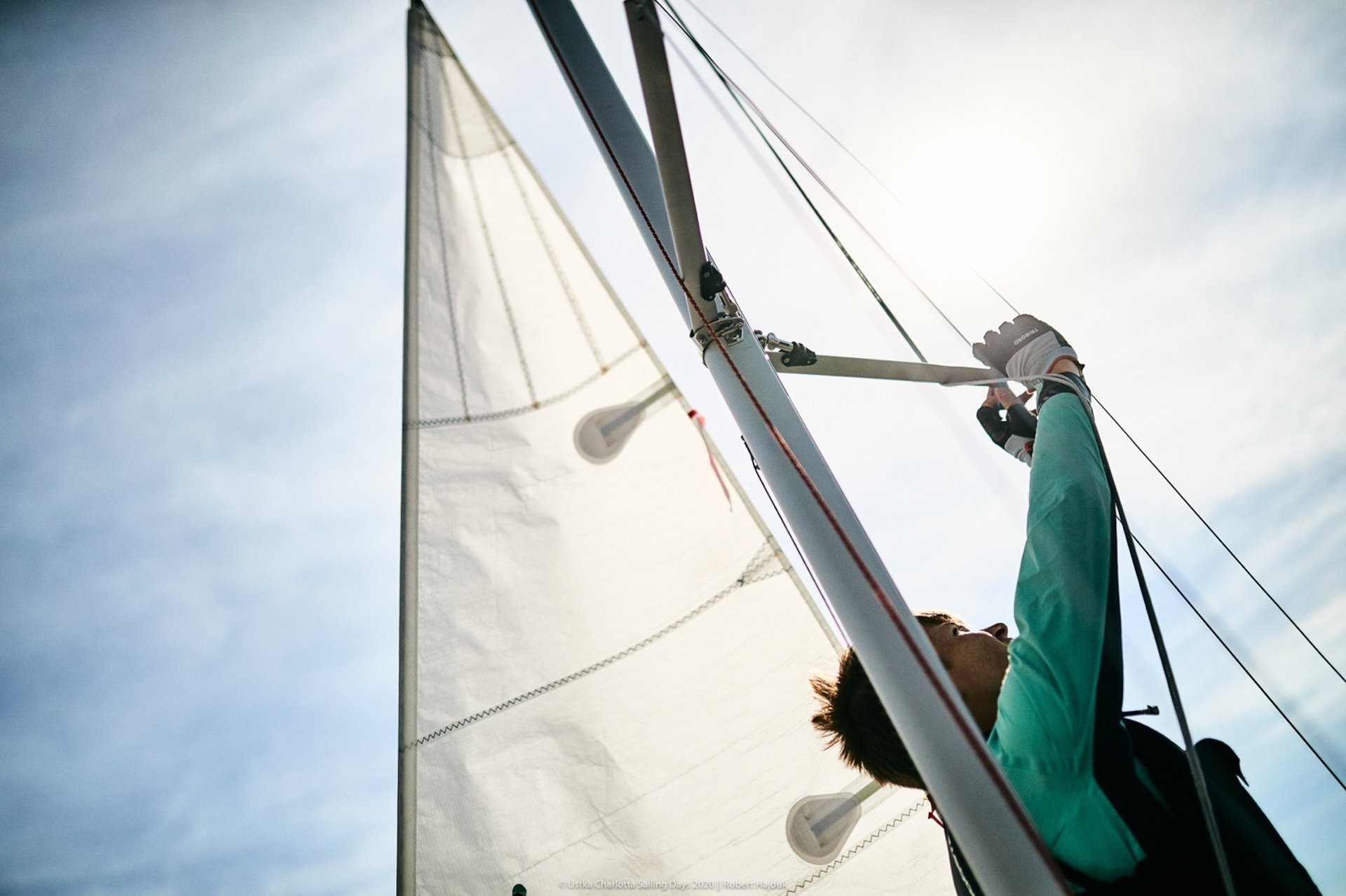 an abstract photo of a curved building with a blue sky in the background