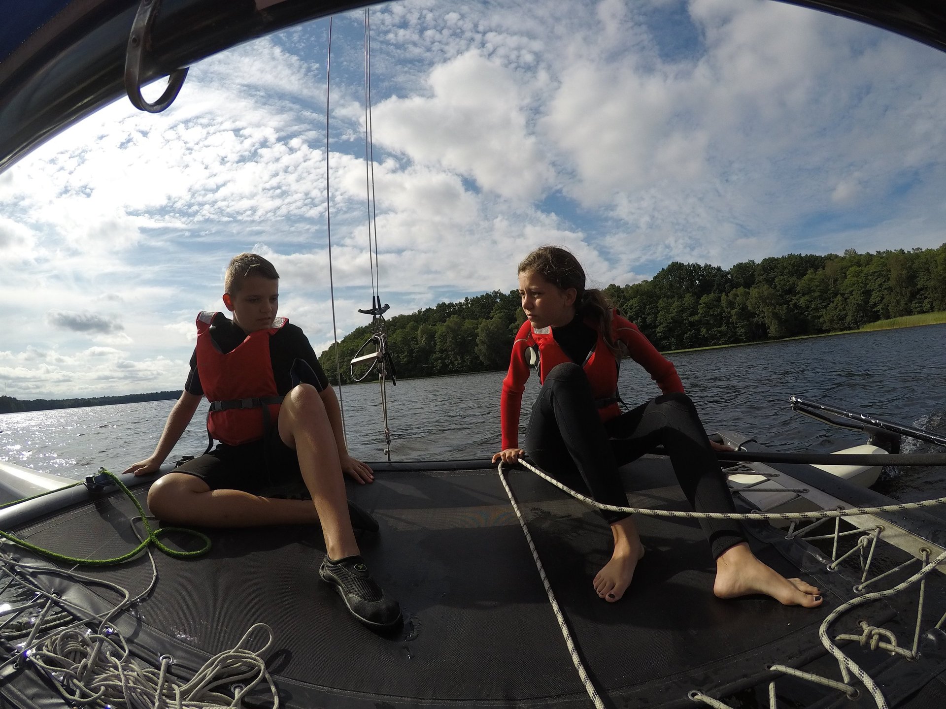 an abstract photo of a curved building with a blue sky in the background