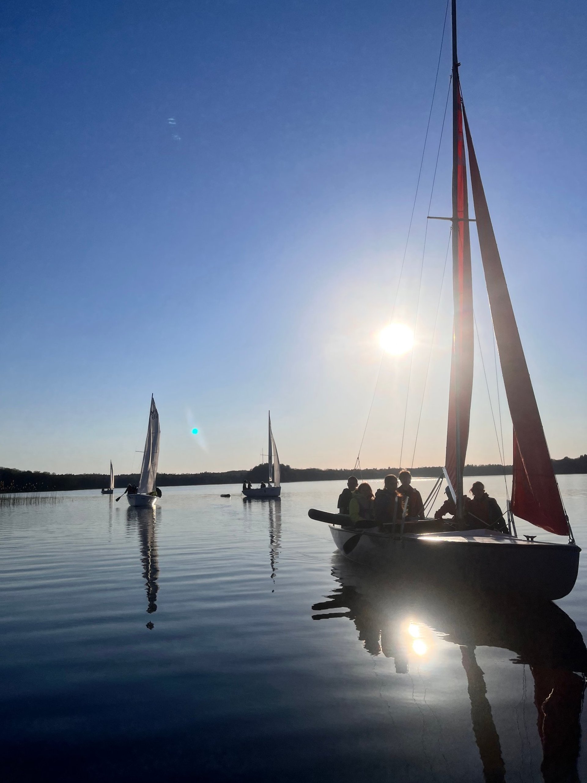 an abstract photo of a curved building with a blue sky in the background
