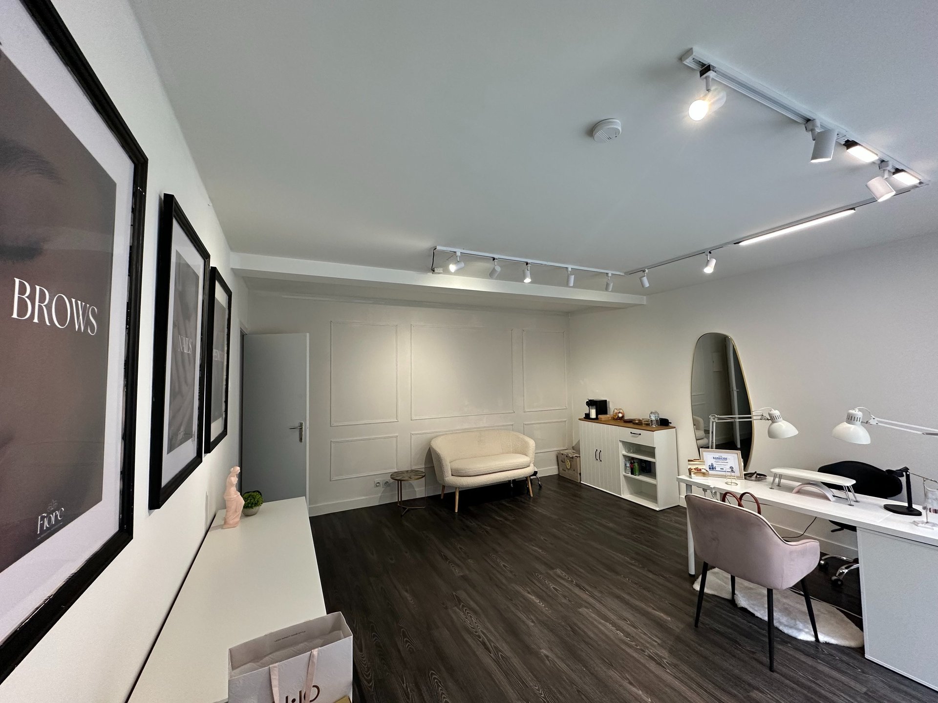 a woman's hands with manicured nails and a ring