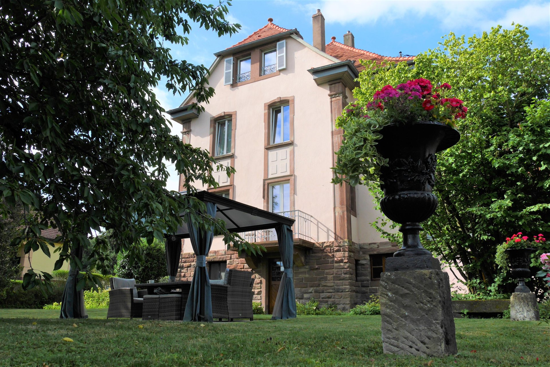 an abstract photo of a curved building with a blue sky in the background