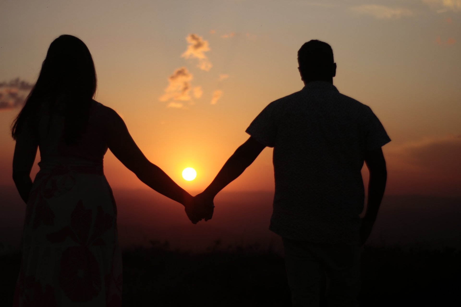 couple wearing silver-colored rings
