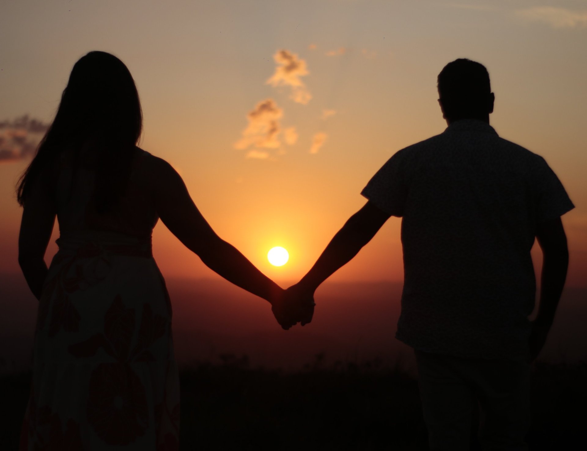 couple wearing silver-colored rings