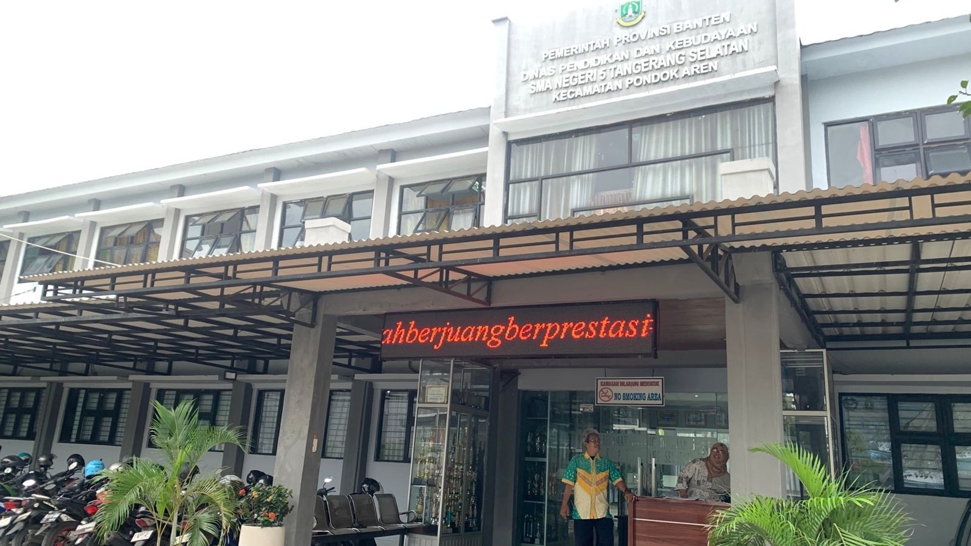an abstract photo of a curved building with a blue sky in the background