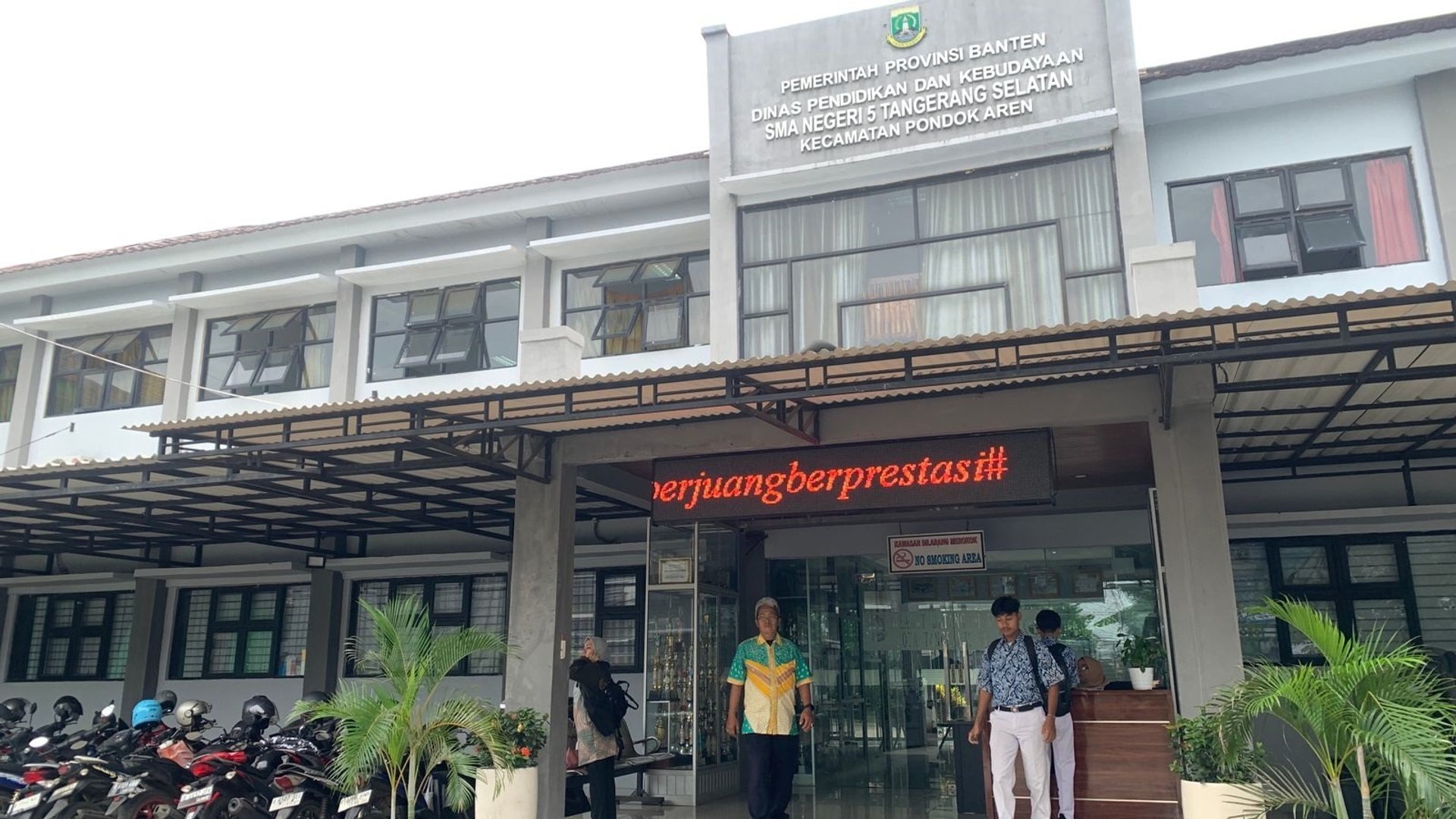 an abstract photo of a curved building with a blue sky in the background