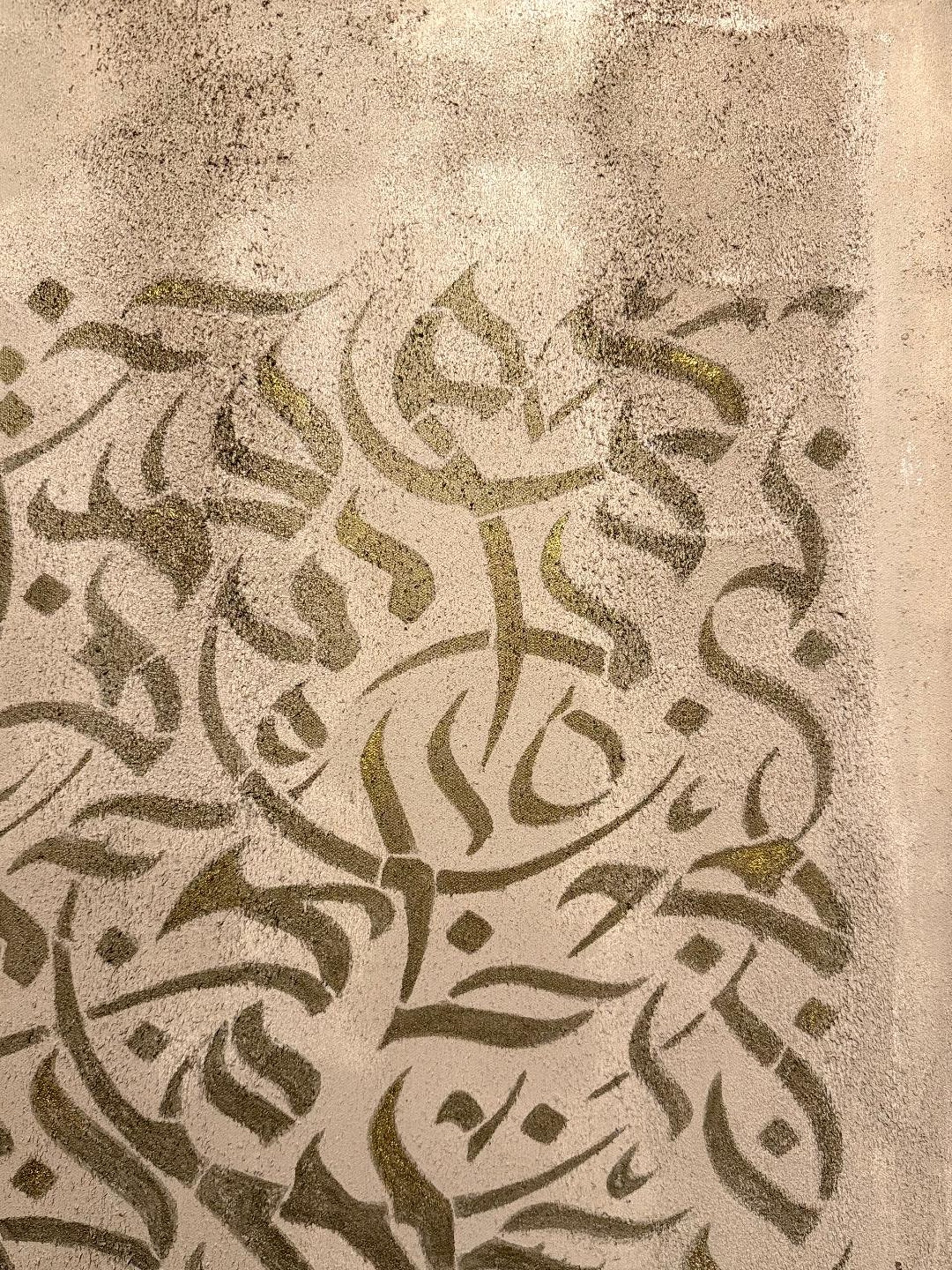 an abstract photo of a curved building with a blue sky in the background