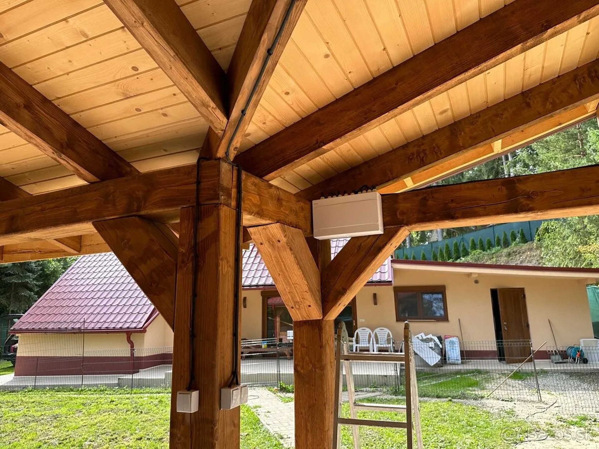 an abstract photo of a curved building with a blue sky in the background