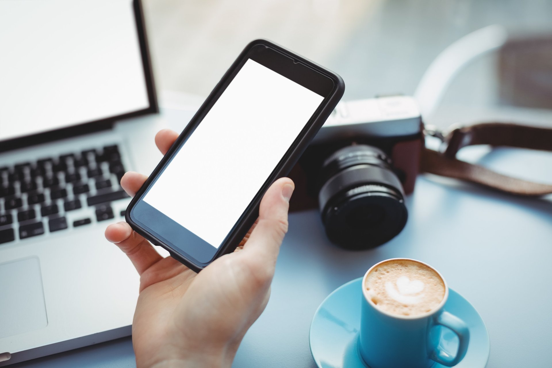 person holding white Android smartphone in white shirt
