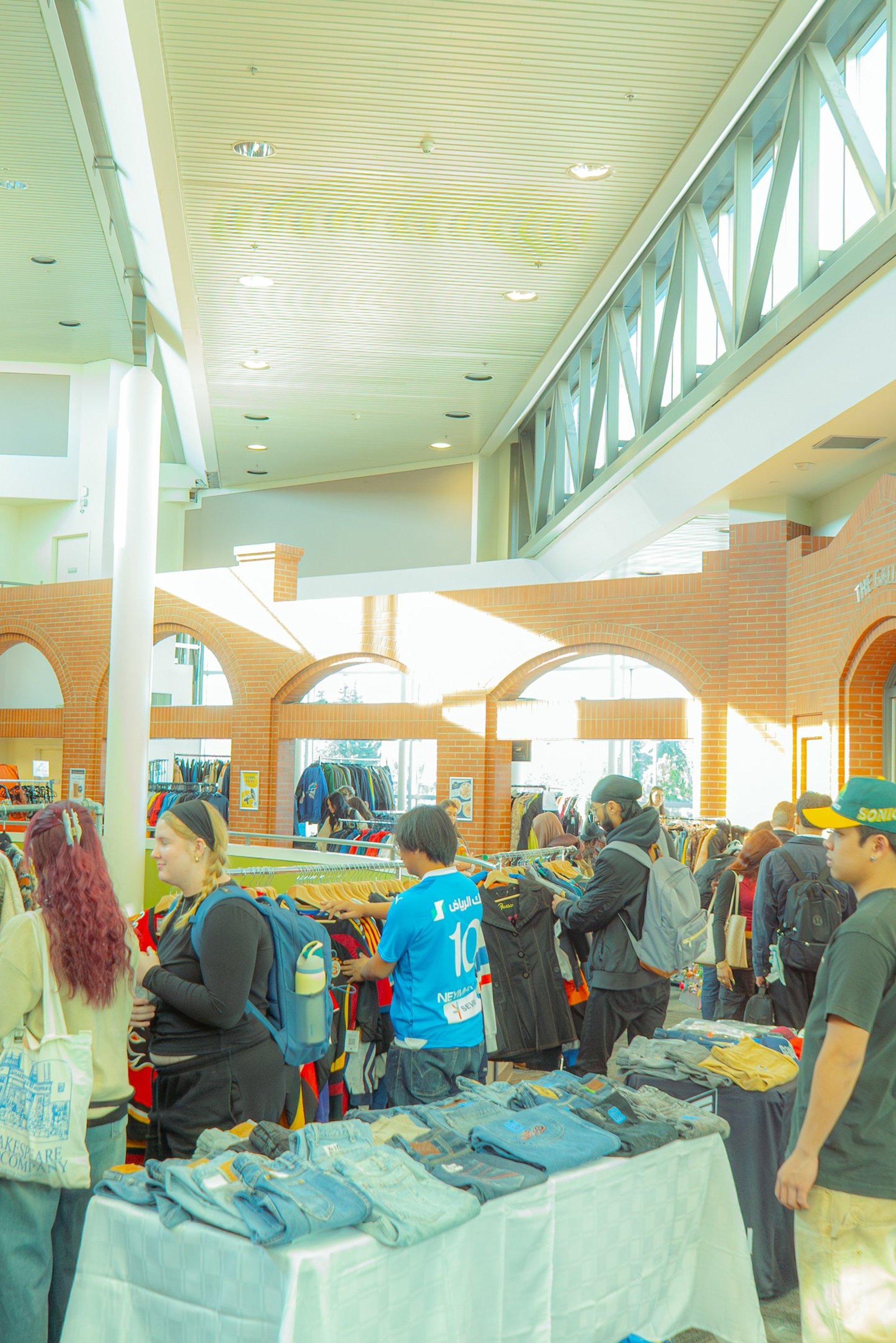an abstract photo of a curved building with a blue sky in the background