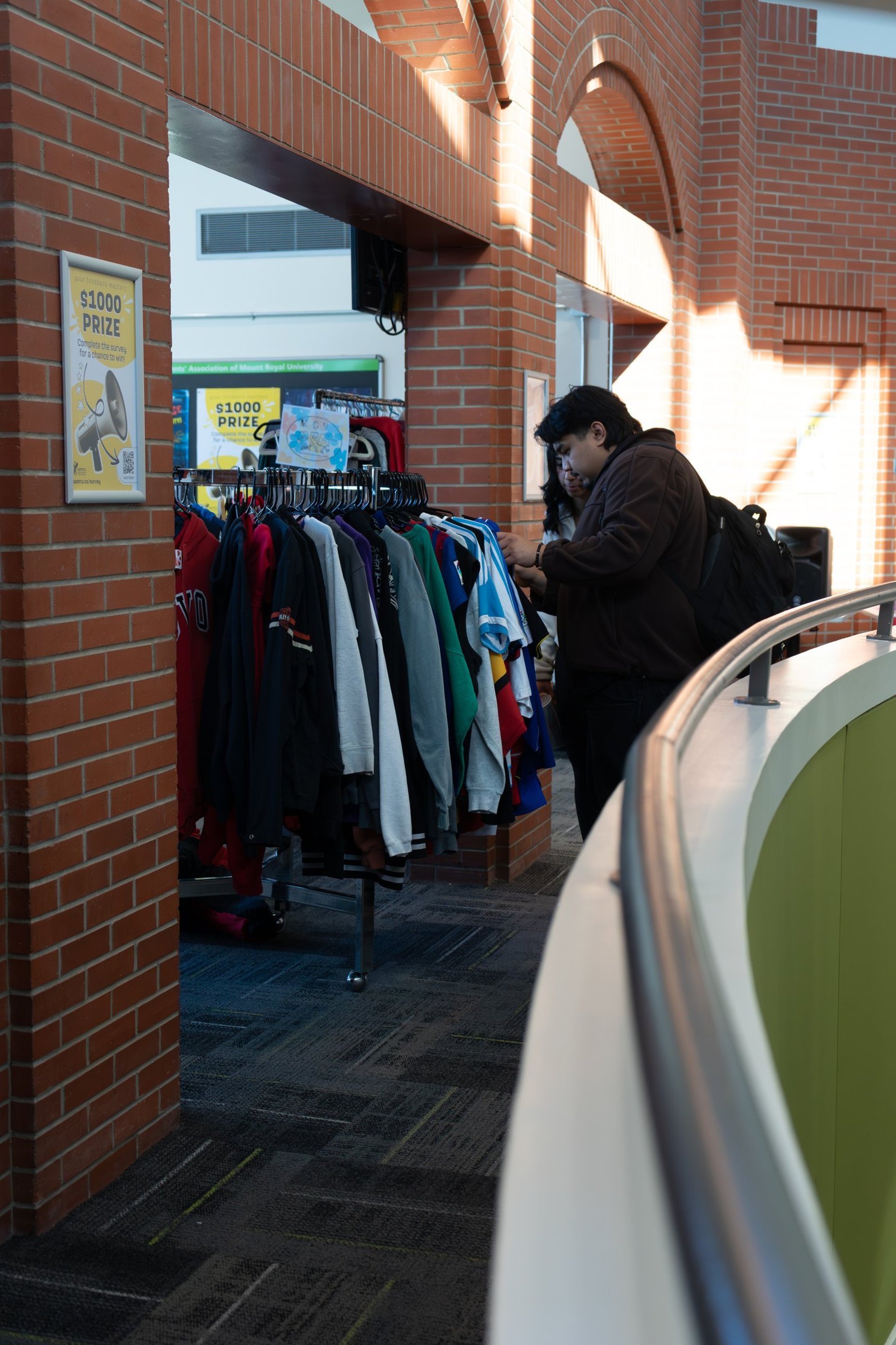 an abstract photo of a curved building with a blue sky in the background