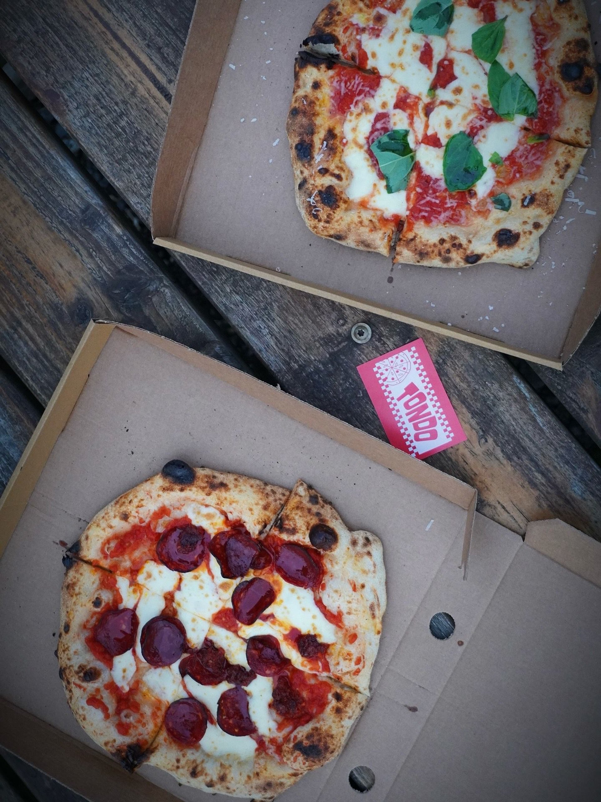 an abstract photo of a curved building with a blue sky in the background