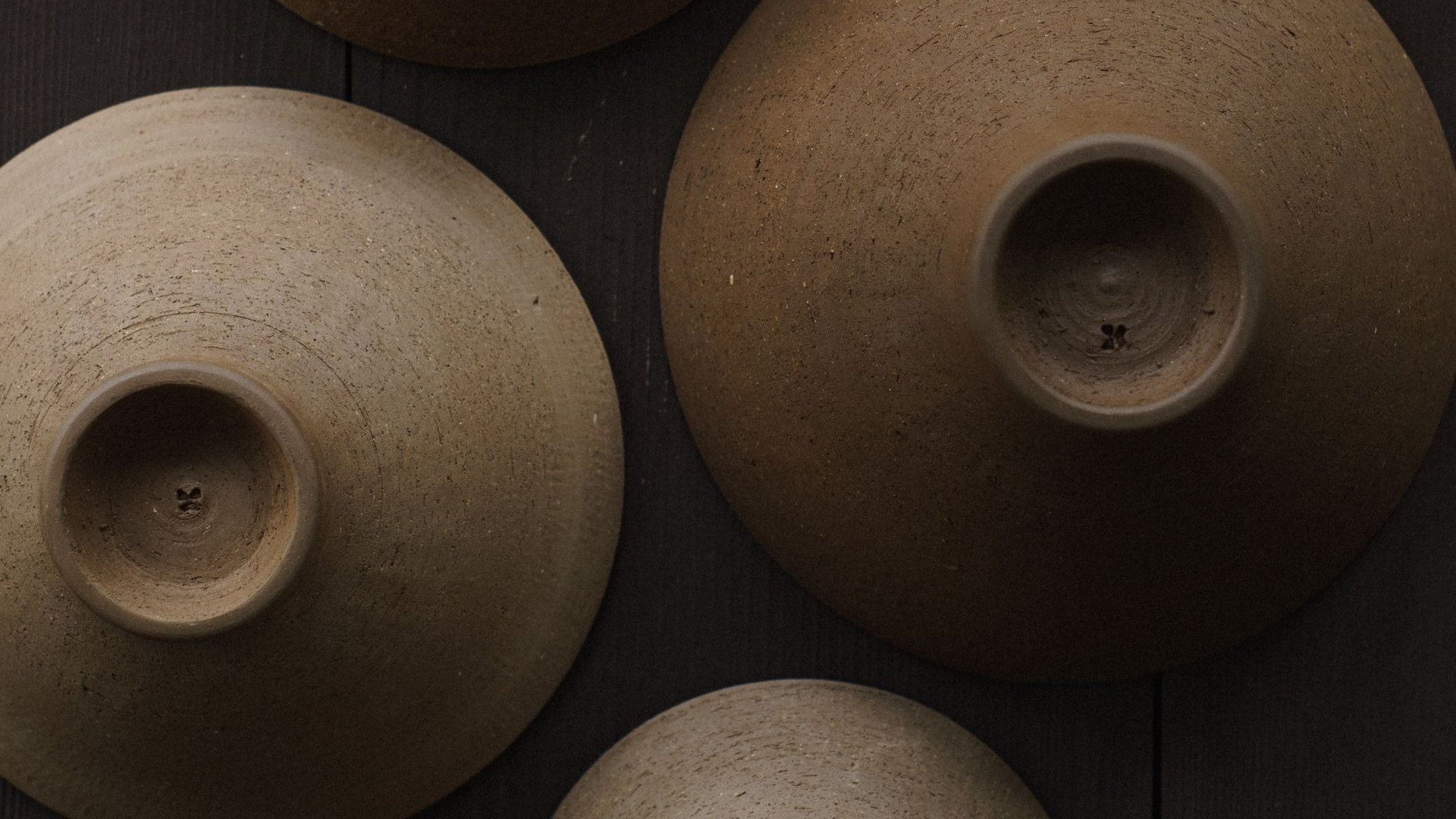 an abstract photo of a curved building with a blue sky in the background